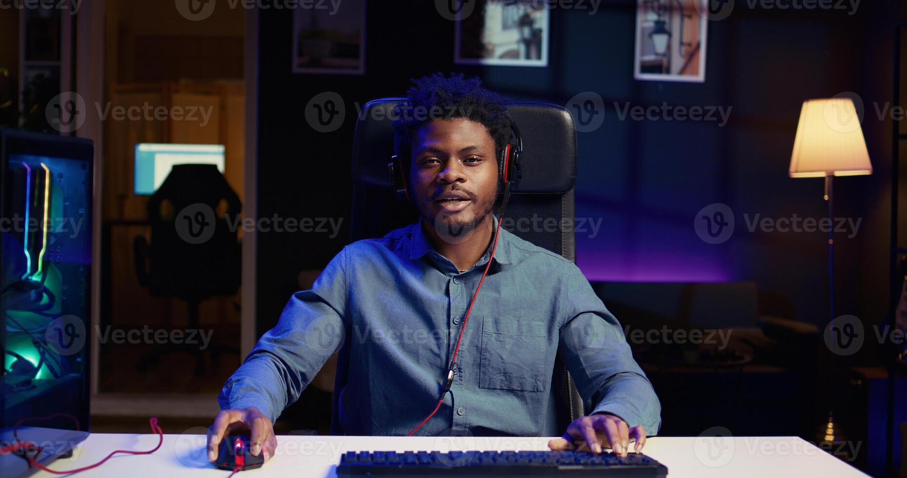 Gamer discussing with audience multiplayer game match winning strategies during livestream. Content creator chatting with viewers, presenting ways of being victorious in esports tournaments photo