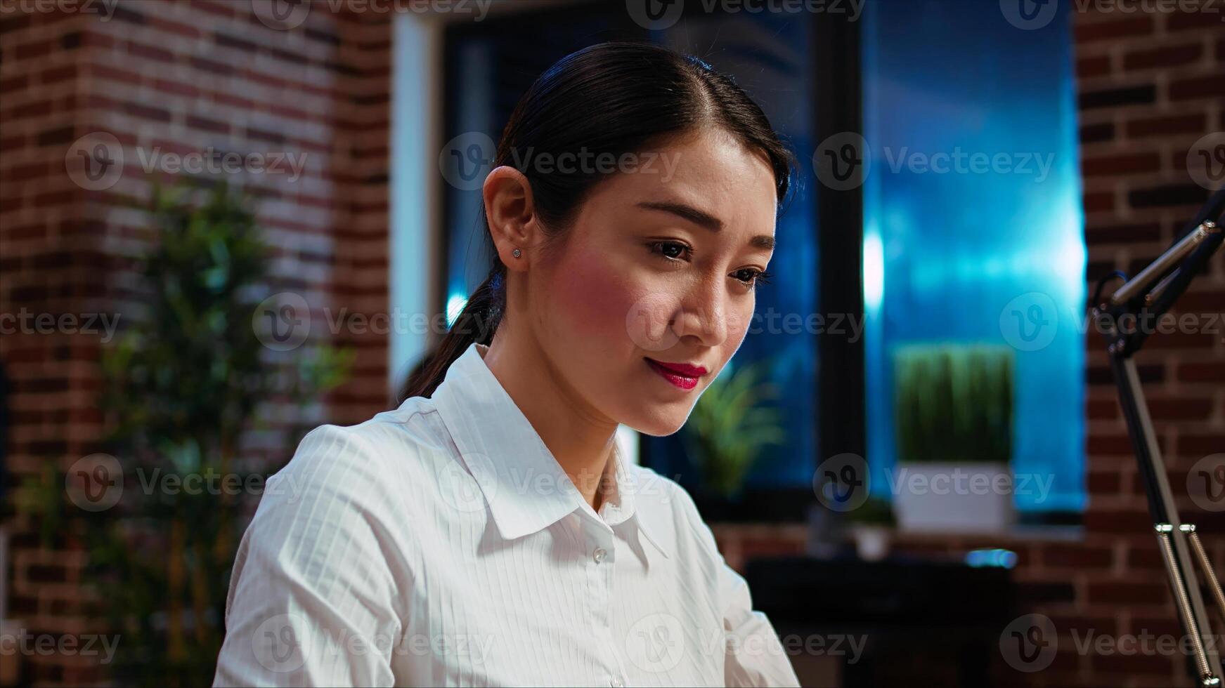 Businesswoman planning marketing project on laptop late at night, using sales statistics on charts. Office employee working on strategy research to create financial development, camera A photo
