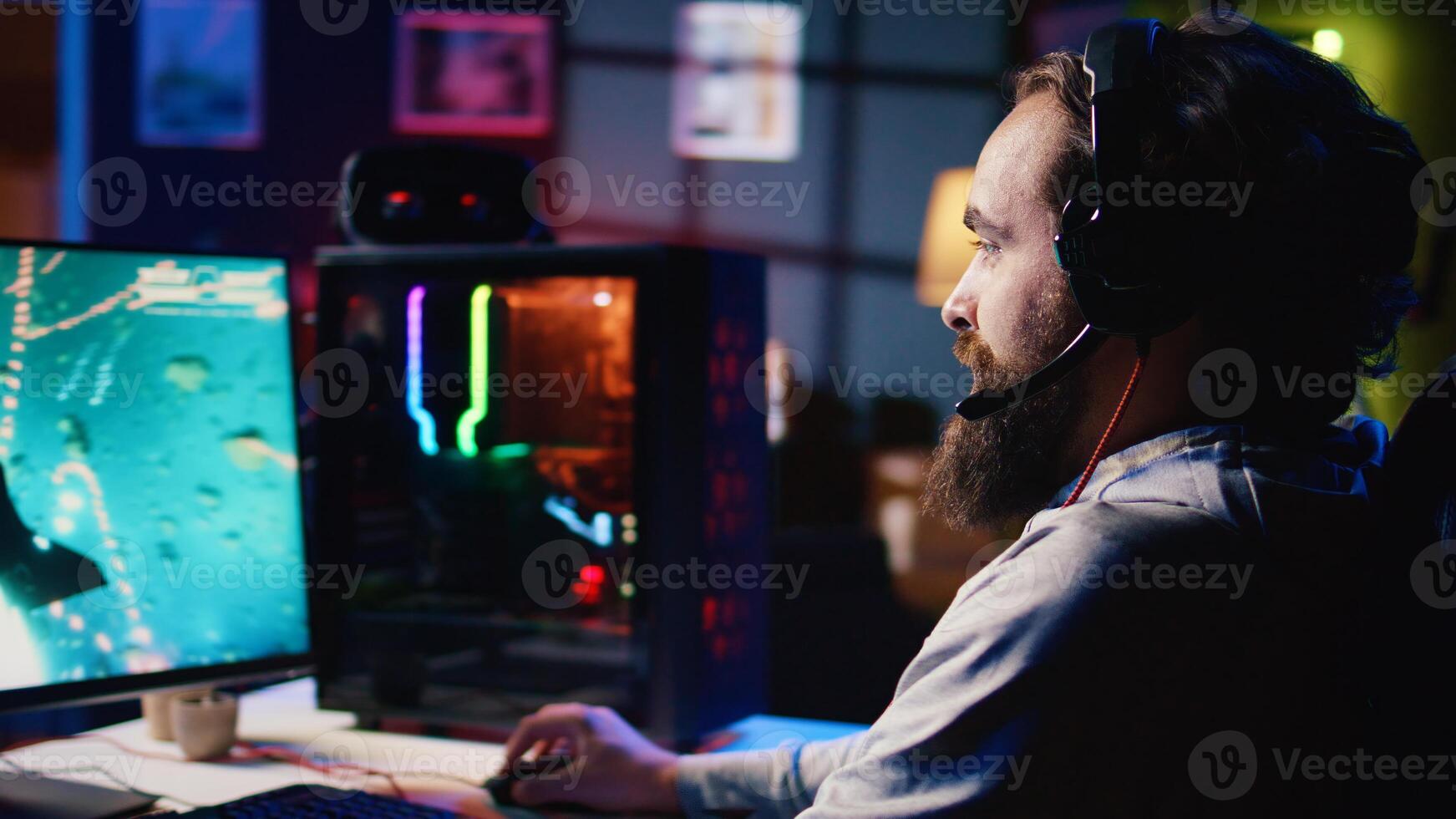 Happy man using headphones to play spaceship flying singleplayer game with overlay HUD showing health, fuel, ammo bars and minimap. Smiling gamer immersed in gaming experience, navigating universe photo