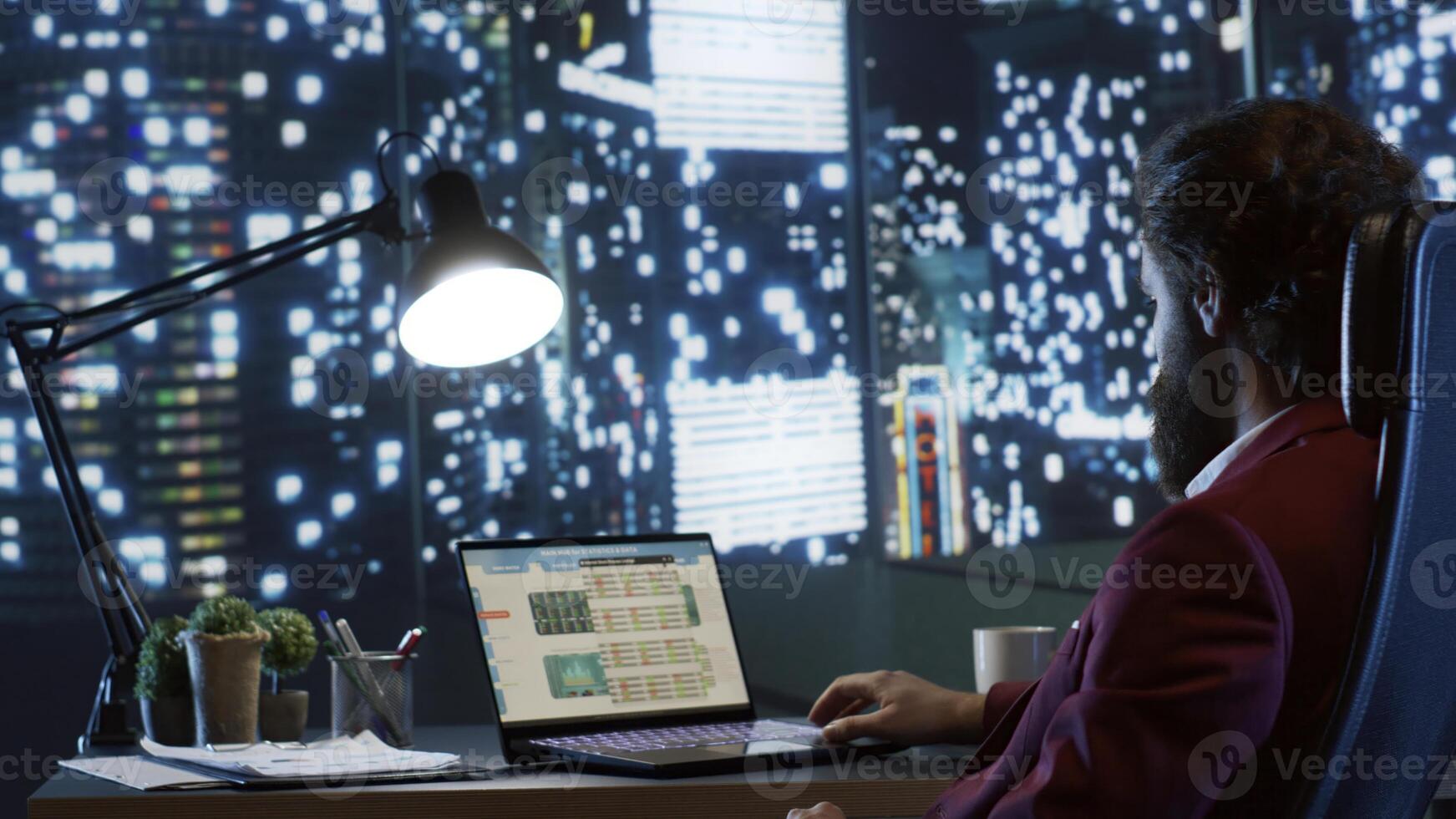 Rich executive director admiring skyscraper view at night, working after hours to improve company financial situation. Professional business expert looking for ways to expand globally. photo
