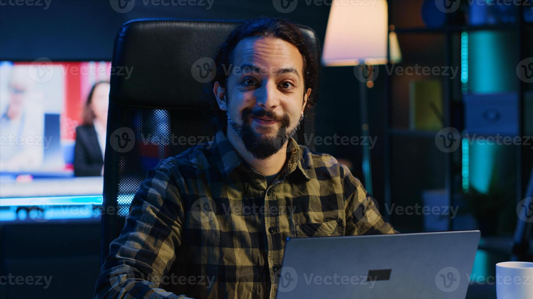 Portrait of smiling freelancer working from home, typing on laptop, surfing the net. Joyful remote employee browsing on digital device, sending emails to customers, camera A photo