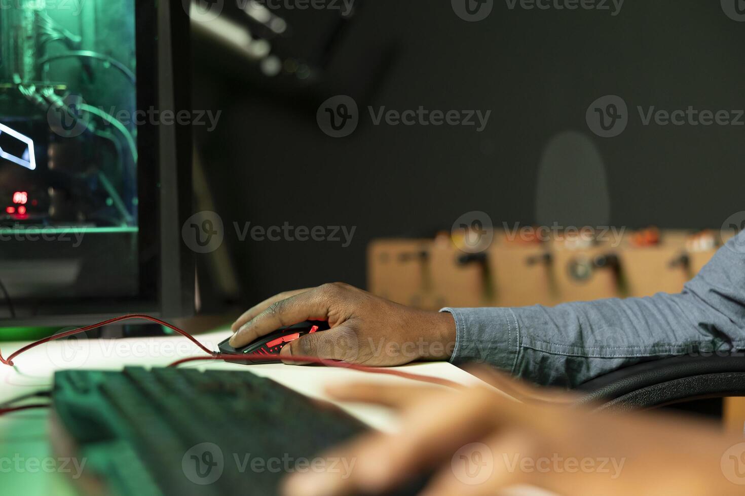 Gamer using keyboard and mouse to play FPS singleplayer videogame on PC, enjoying leisure time. Person in apartment at night using high tech computer peripherals to destroy enemies, close up photo