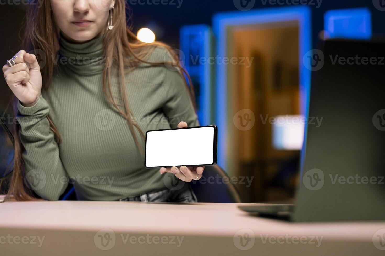 Content creator reviewing newly released mockup smartphone, comparing features with older models. Influencer filming for social media, analyzing latest generation of isolated screen mobile phone photo