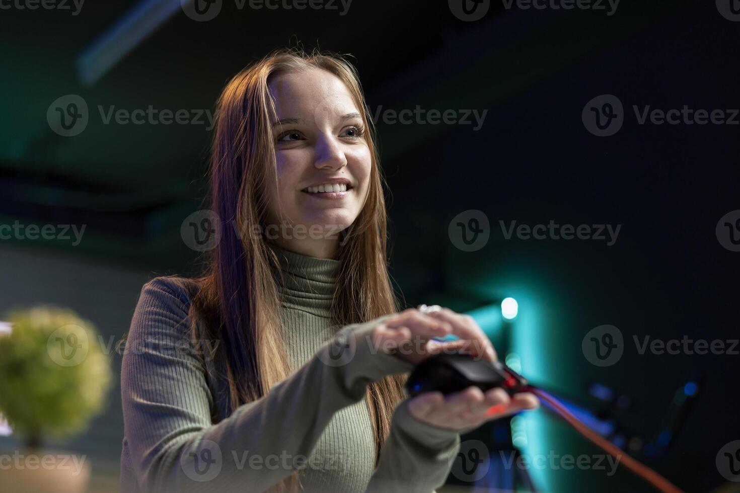 Smiling gen Z influencer presenting wired gaming mouse from brand sponsoring , urging viewers to buy it. Upbeat internet star excited to promote computer peripherals to audience photo