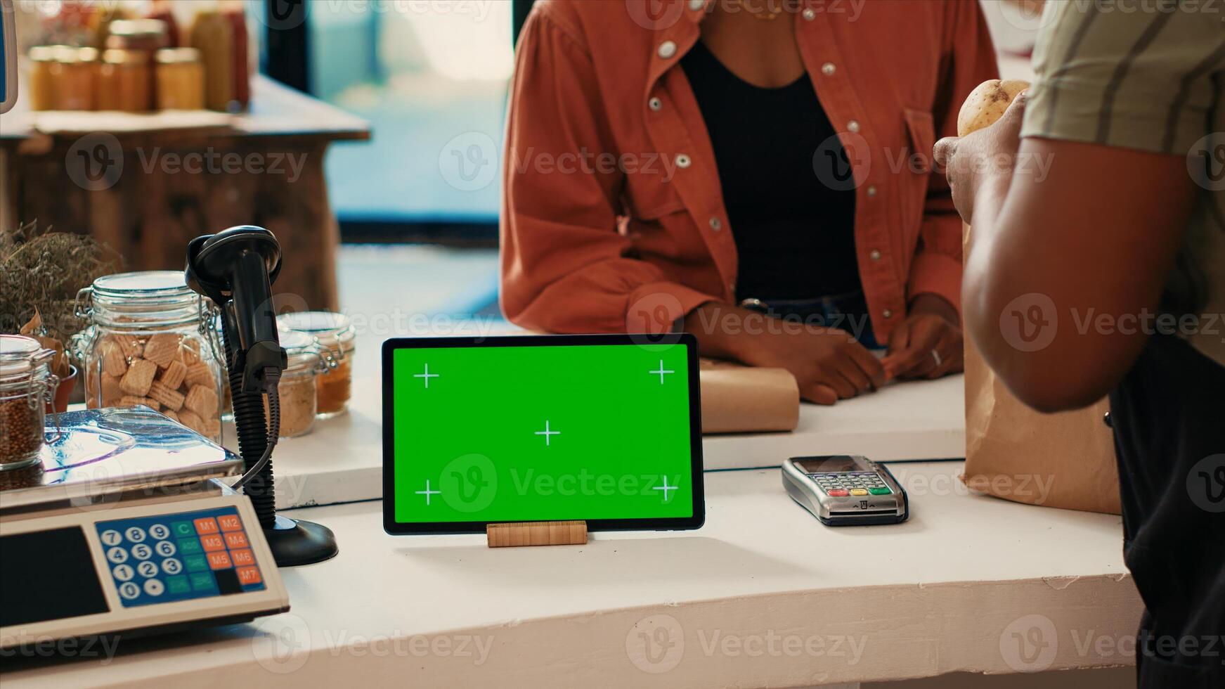 Tablet running display with blank greenscreen at checkout, showing isolated chromakey layout in local grocery store. Merchant having device with copyspace mockup layout, nonpolluting small business. photo
