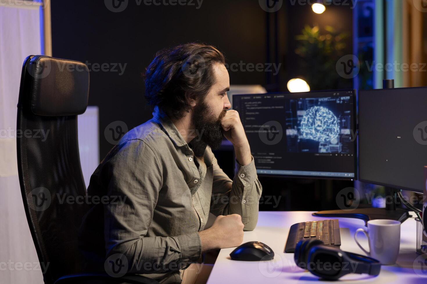 Programmer updating artificial intelligence deep learning algorithm, writing binary code scripts. IT specialist in apartment office uses programming to upgrade AI, waiting for software to load photo