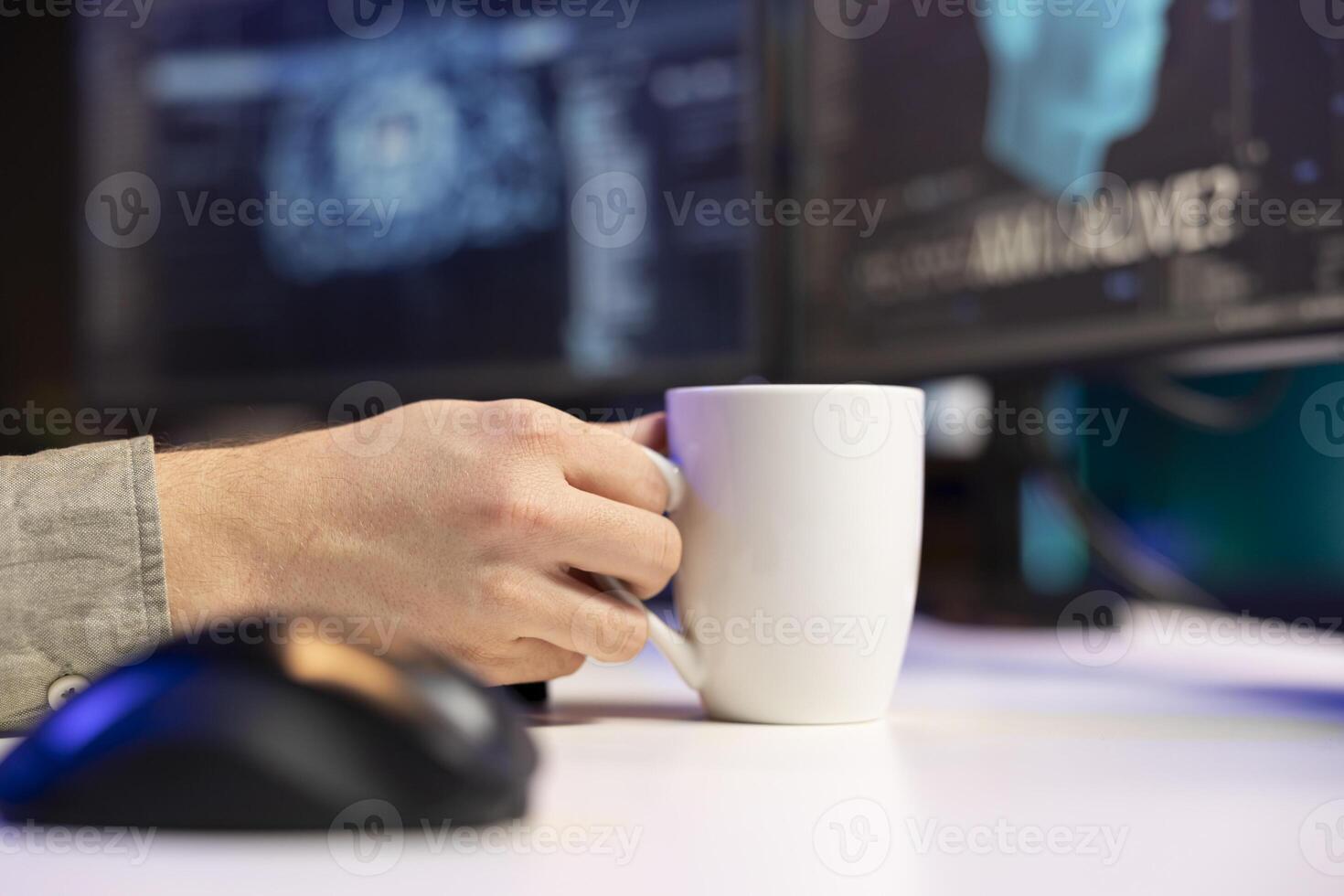 Man at home enjoying hot beverage, witnessing AI becoming sentient, asking questions about itself. Close up of man holding coffee mug, talking with artificial intelligence becoming self aware photo