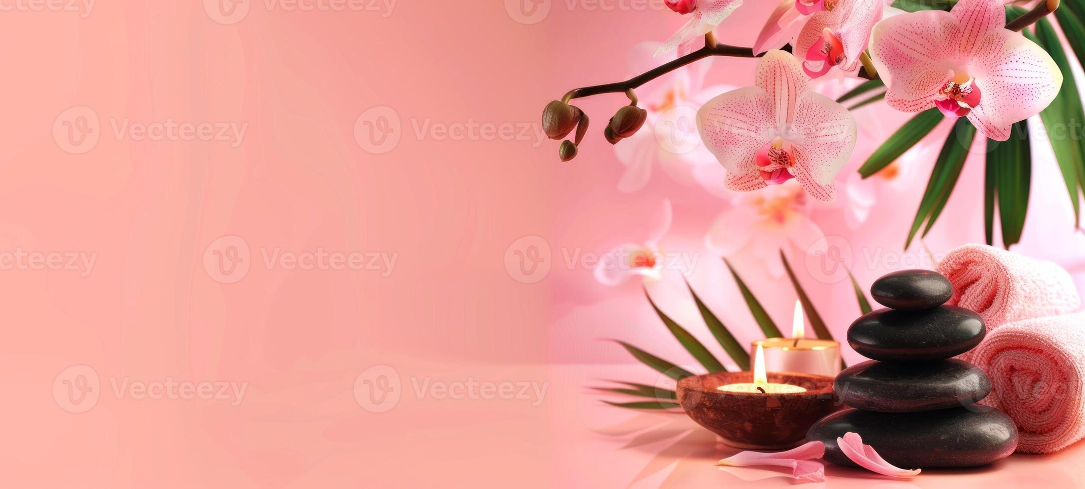 Elegant spa setting with lit candles, orchid flowers, towels. Calming pink wellness retreat for relaxation. Concept of luxury Thai spa, tranquility, self-care, health retreat. Banner. Copy space photo