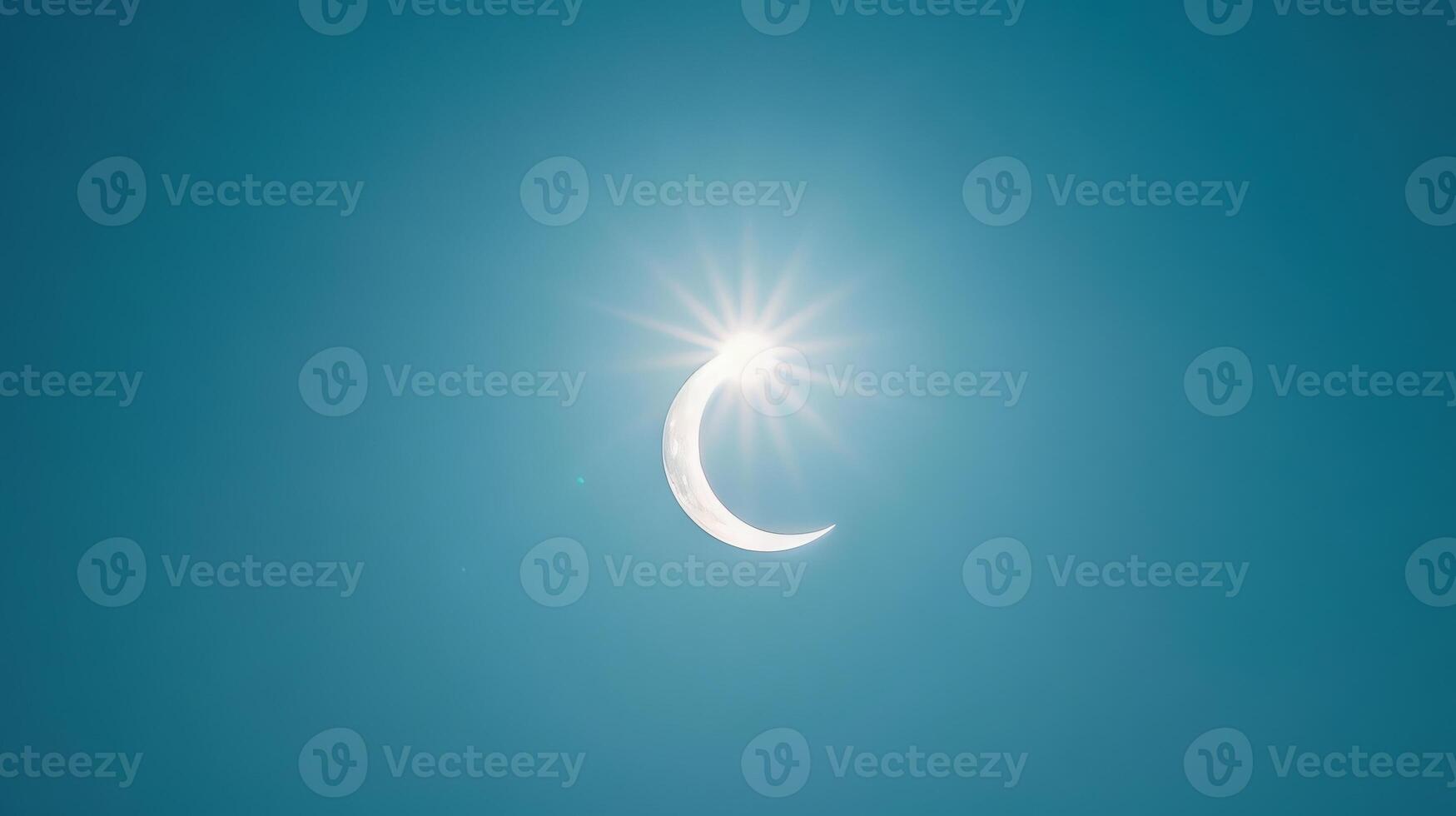 Bright crescent sun during a partial eclipse against a dark sky. Partial solar eclipse against a dim sky. Concept of astronomical event, solar observation, celestial phenomena, and sky watching photo