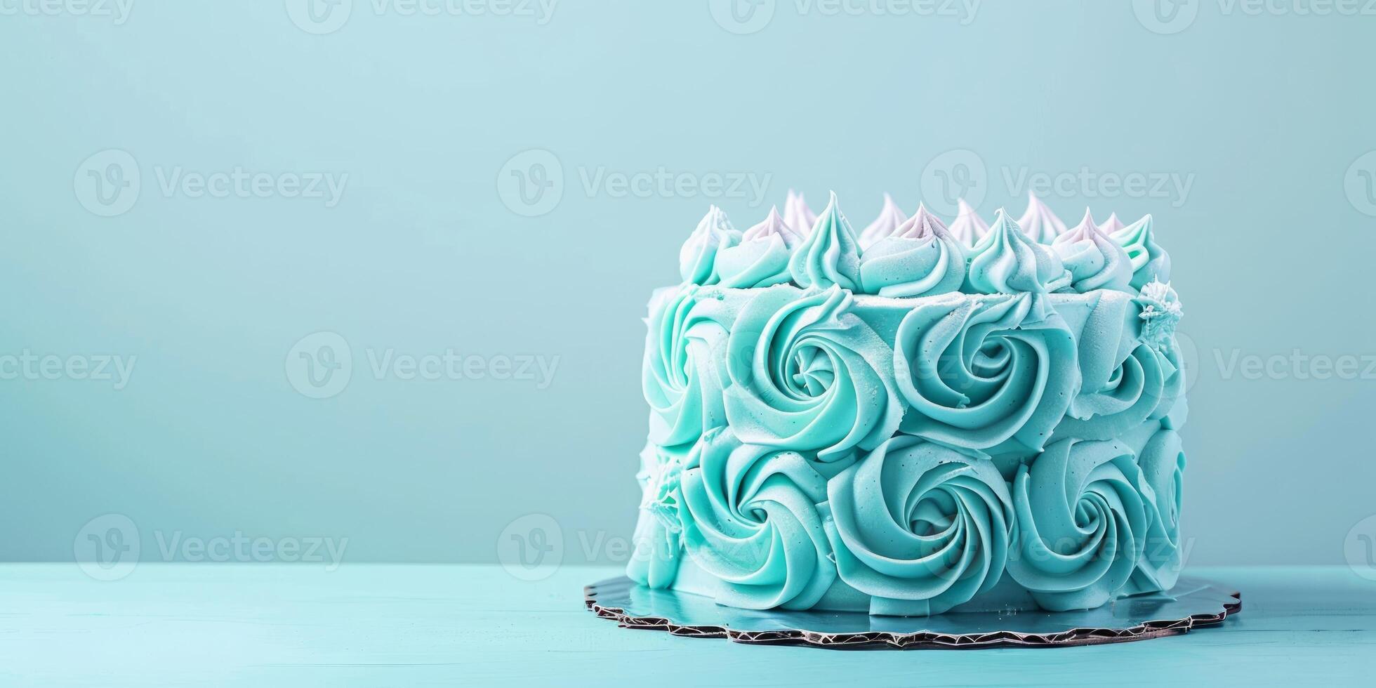 Blue cake decorated with intricate rose-shaped icing on a blue background. Perfect for birthday celebrations, weddings, and party invitations. Copy space photo
