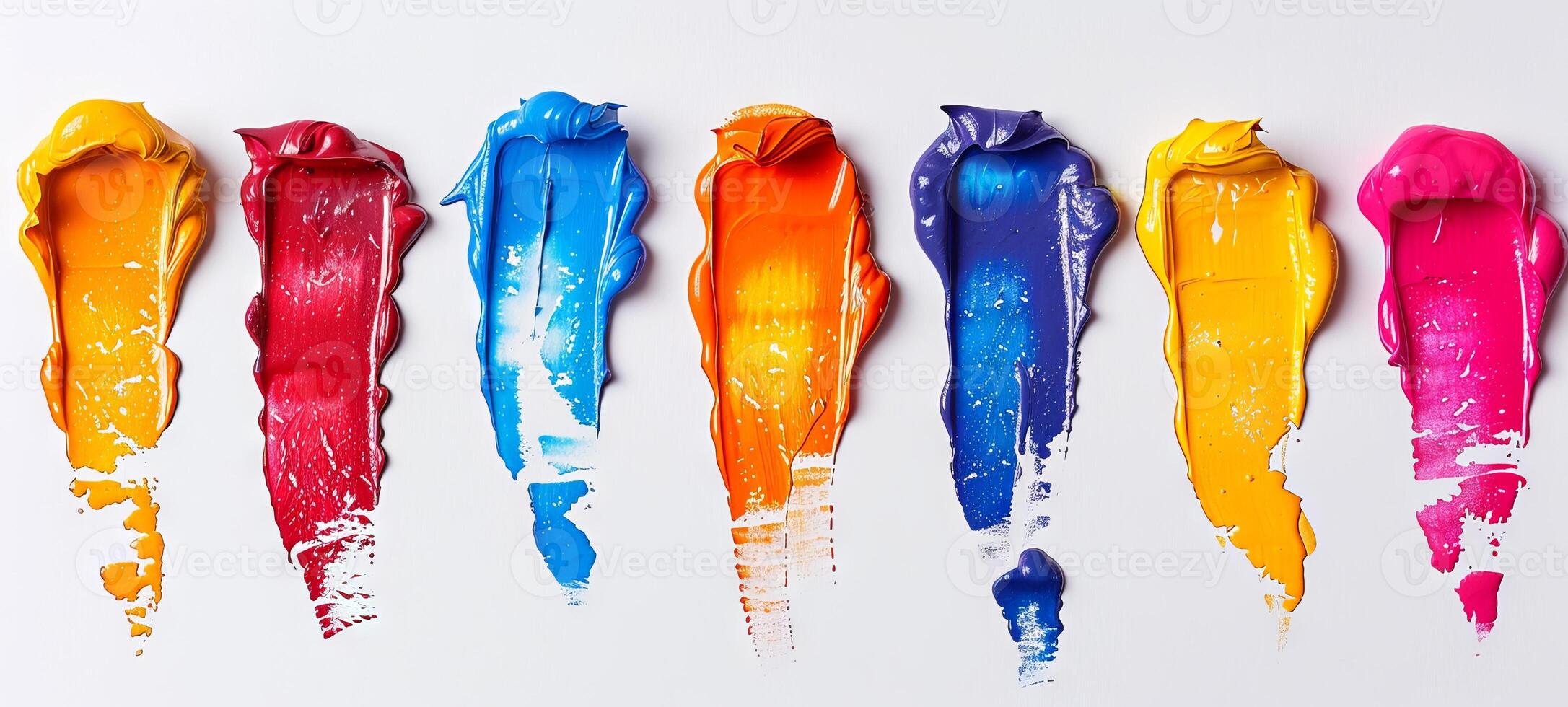 Colorful oil paint strokes in a row on a white background. Concept of vibrant art, painting materials, creative expression, abstract design. Paint stains isolated on white photo