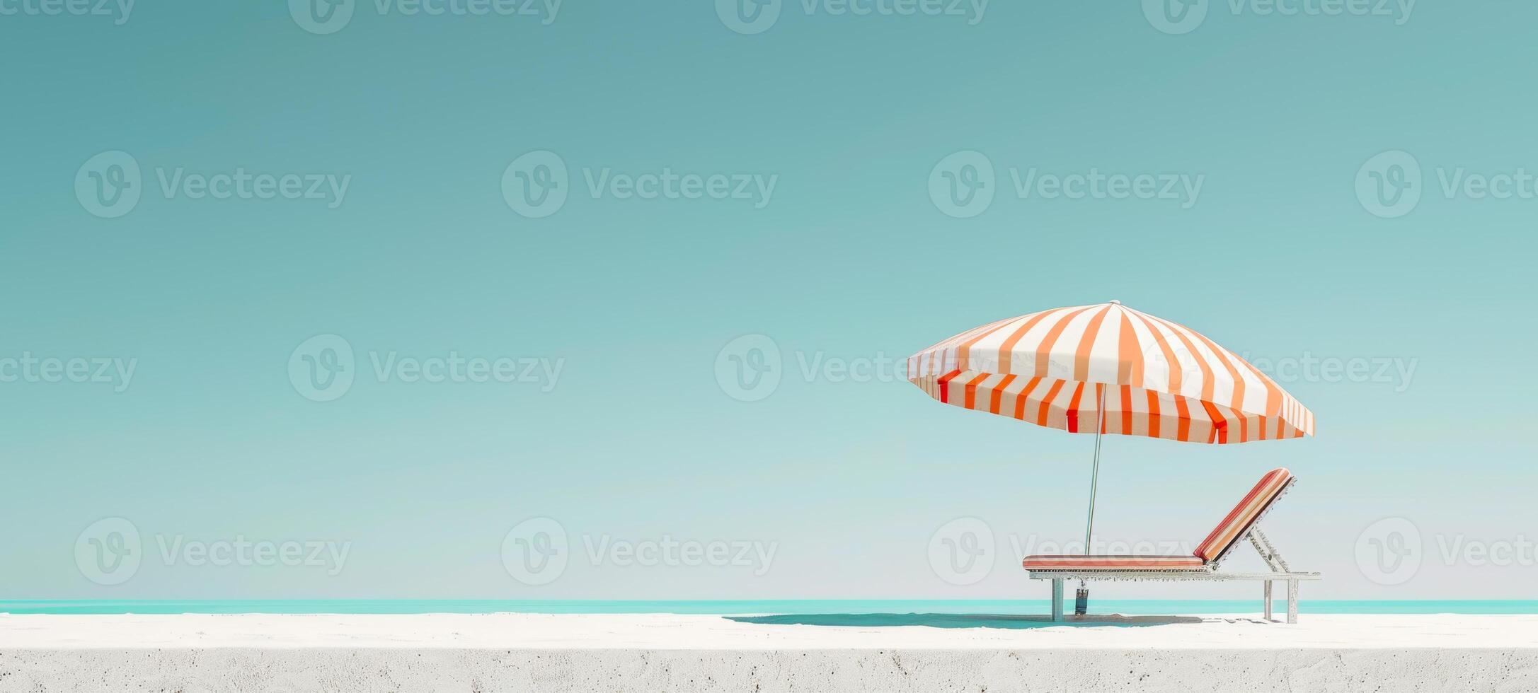Beach umbrella with chair on sandy beach. Single umbrella and chaise lounge setup by the sea. Concept of relaxation, beach leisure, sun protection, and vacation. Banner. Space for text photo