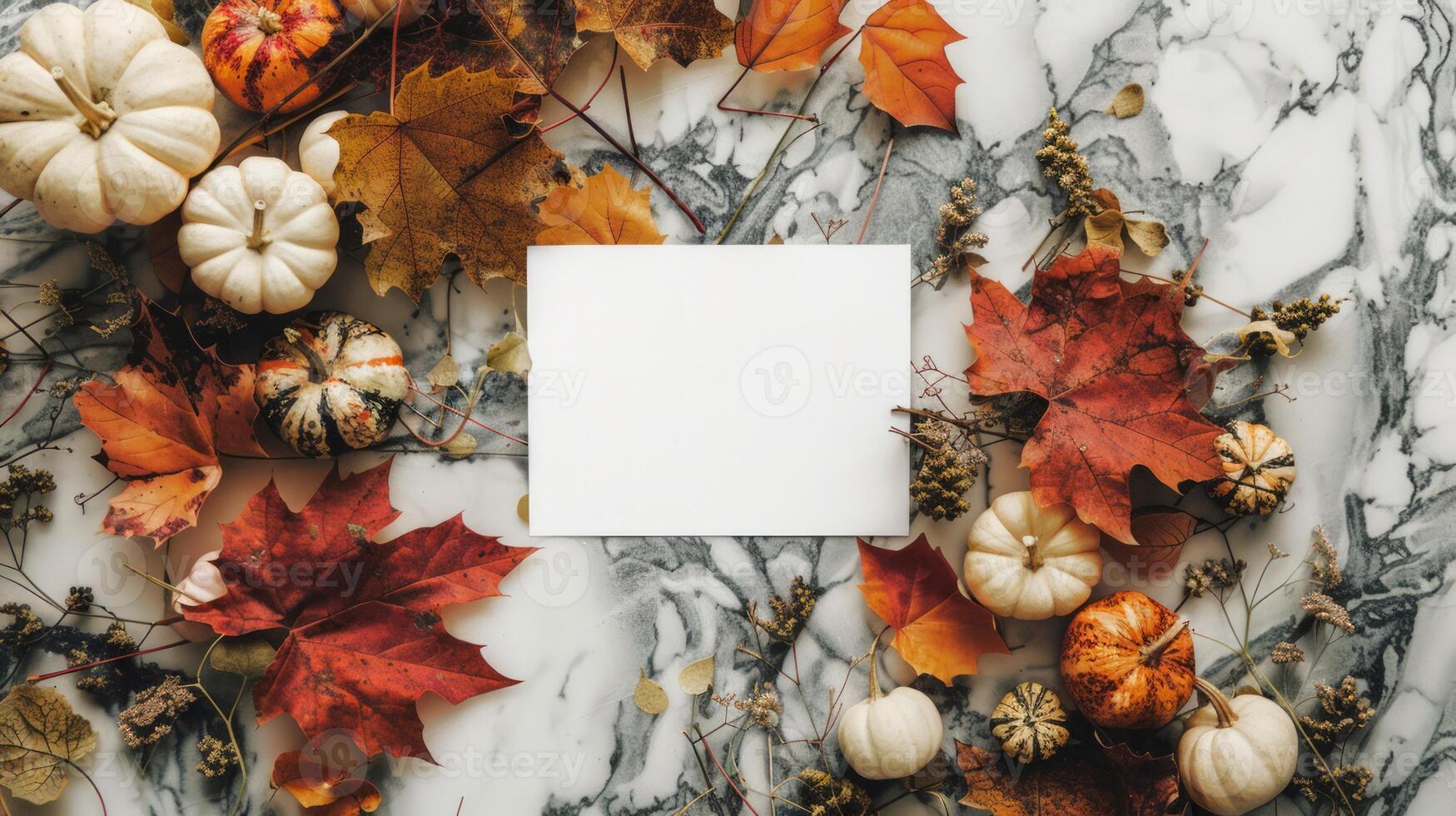 Autumn leaves and pumpkins on marble backdrop. Blank paper sheet for text in center. Thanksgiving mockup with copy space. Concept of fall, holiday card template, Thanksgiving design, harvest festival photo