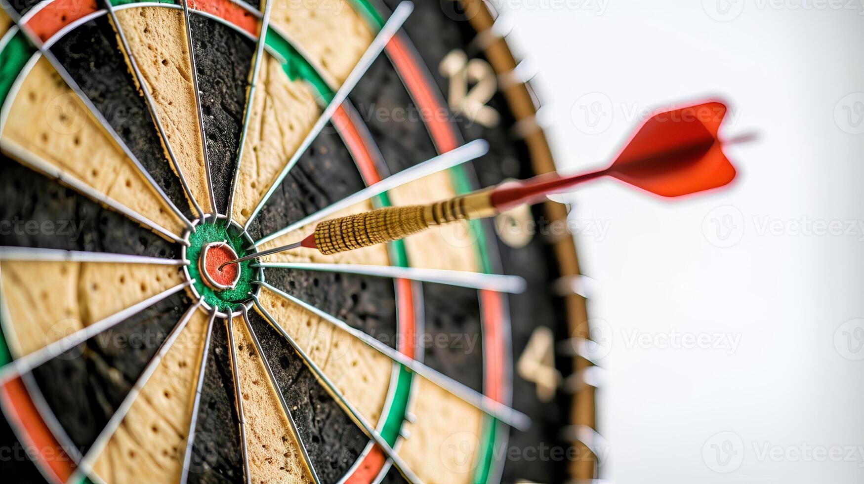 Close-up of a dart hitting the bullseye on a dartboard. Concept of accuracy, precision, target hitting, successful aiming photo