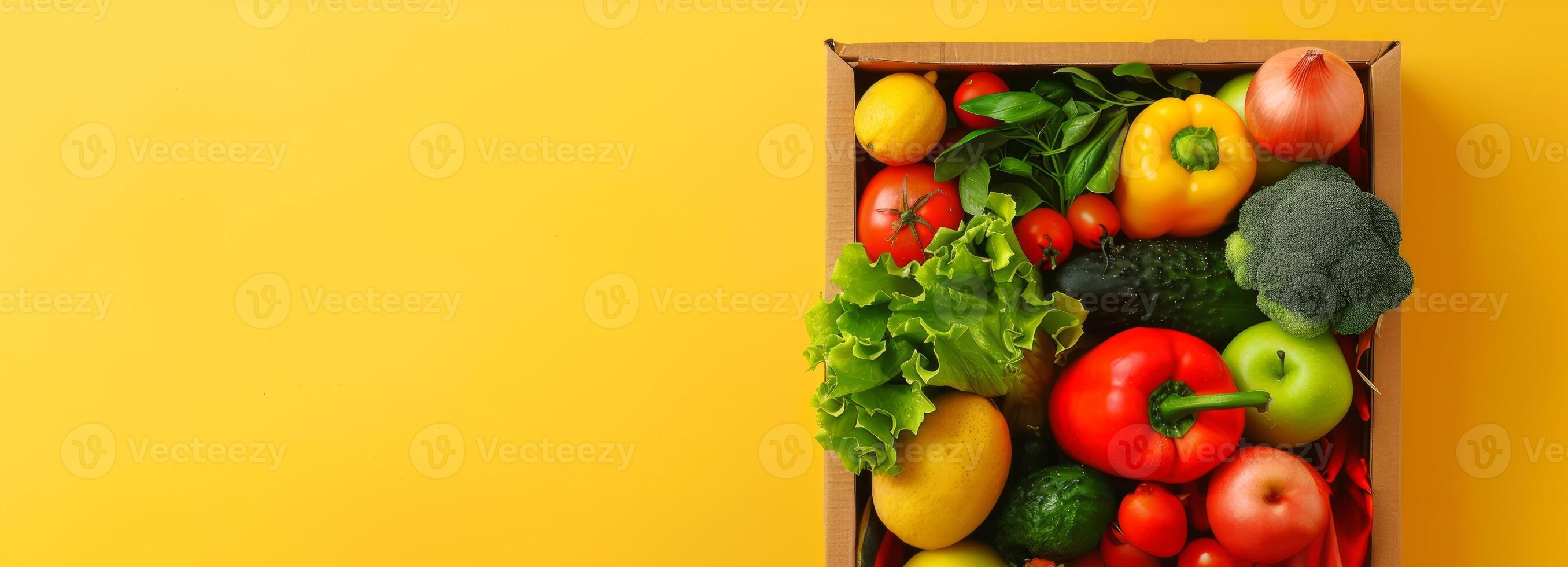 Fresh vegetables in a wooden crate on a yellow background. Healthy eating, organic produce, nutrition, farm-to-table. Concept of healthy lifestyle, diet, colorful food. Banner. Copy space photo