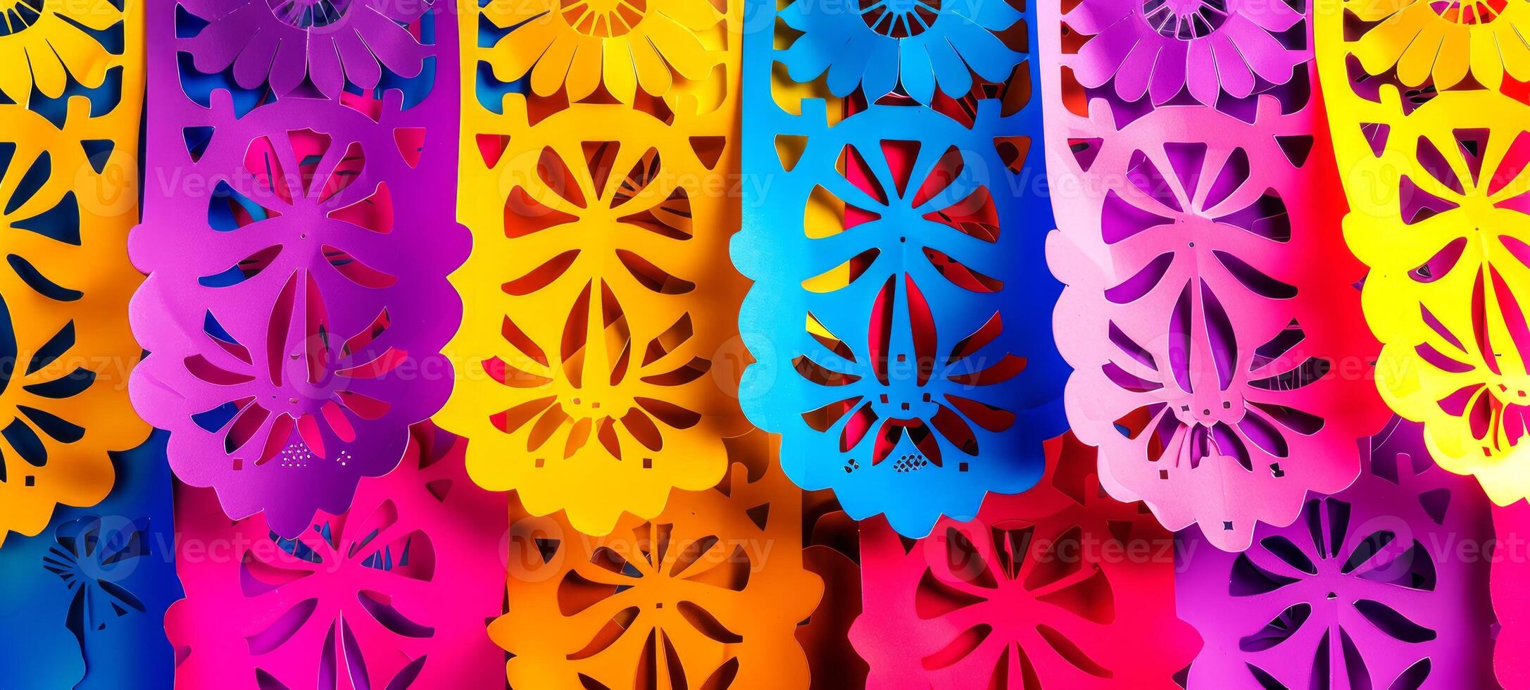 Colorful papel picado banners on a dark background. Vibrant Mexican cut-out decorations. Concept of celebration, festive design, Day of the Dead, Dia de los Muertos. Mexican party decoration photo