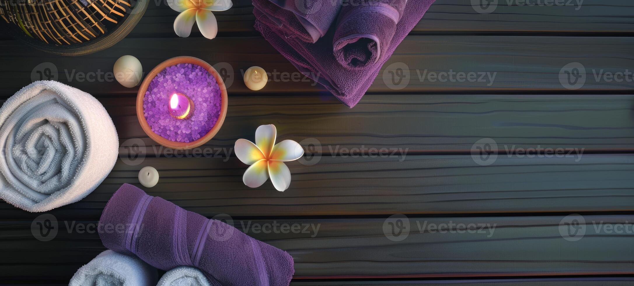 Spa with floating candles and purple towels. Elegant spa setting with decorative flowers and textures. Concept of pampering, serene atmosphere, luxury treatment, and decorative style. Copy space photo