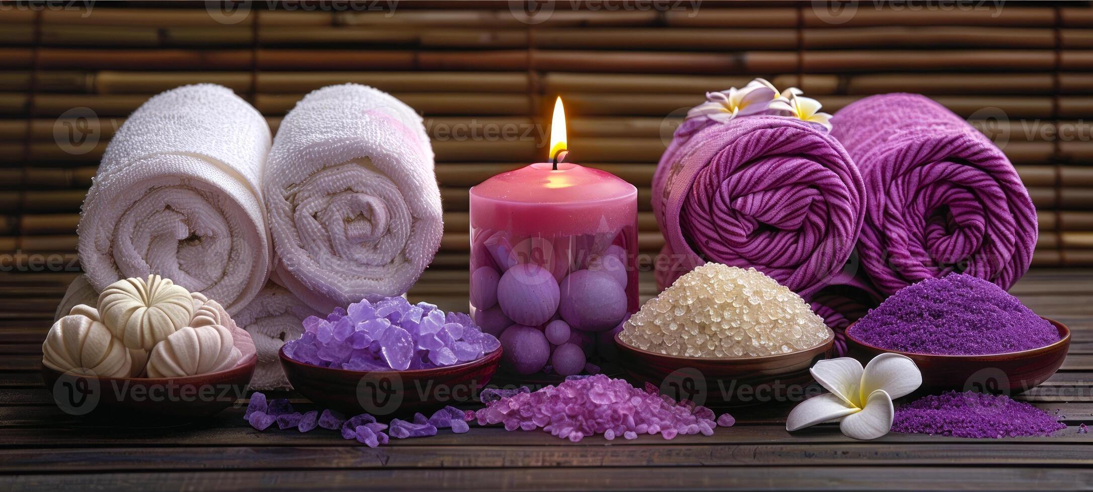 Elegant spa setting with lit purple candles, orchid flowers, aromatic bath salts. Calming wellness retreat for relaxation. Concept of luxury Thai spa, tranquility, health retreat. photo