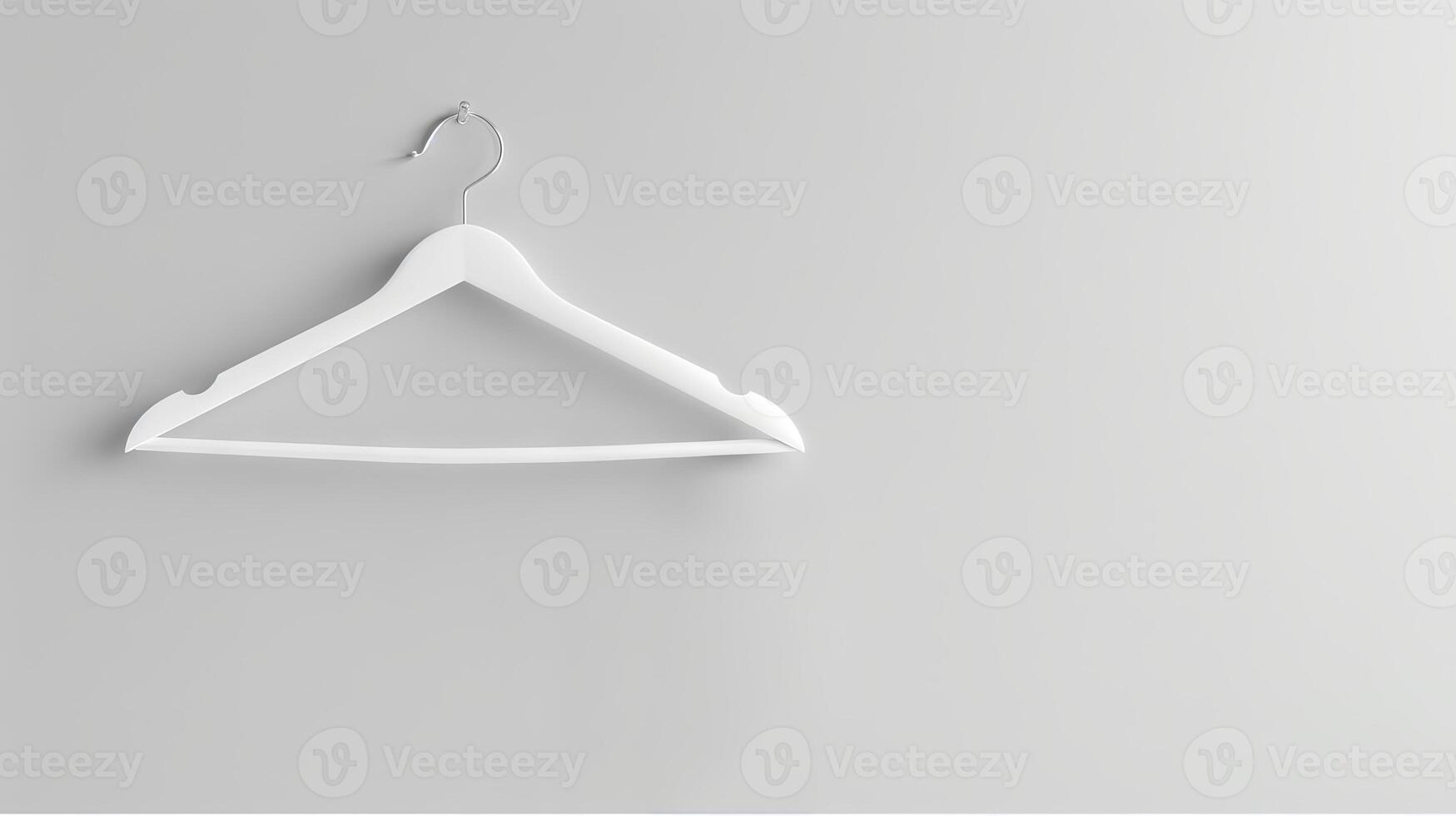White Clothes Hanger on Plain White Wall. Concept of Organization, Minimalism, Simplicity, Interior Design. Copy space photo