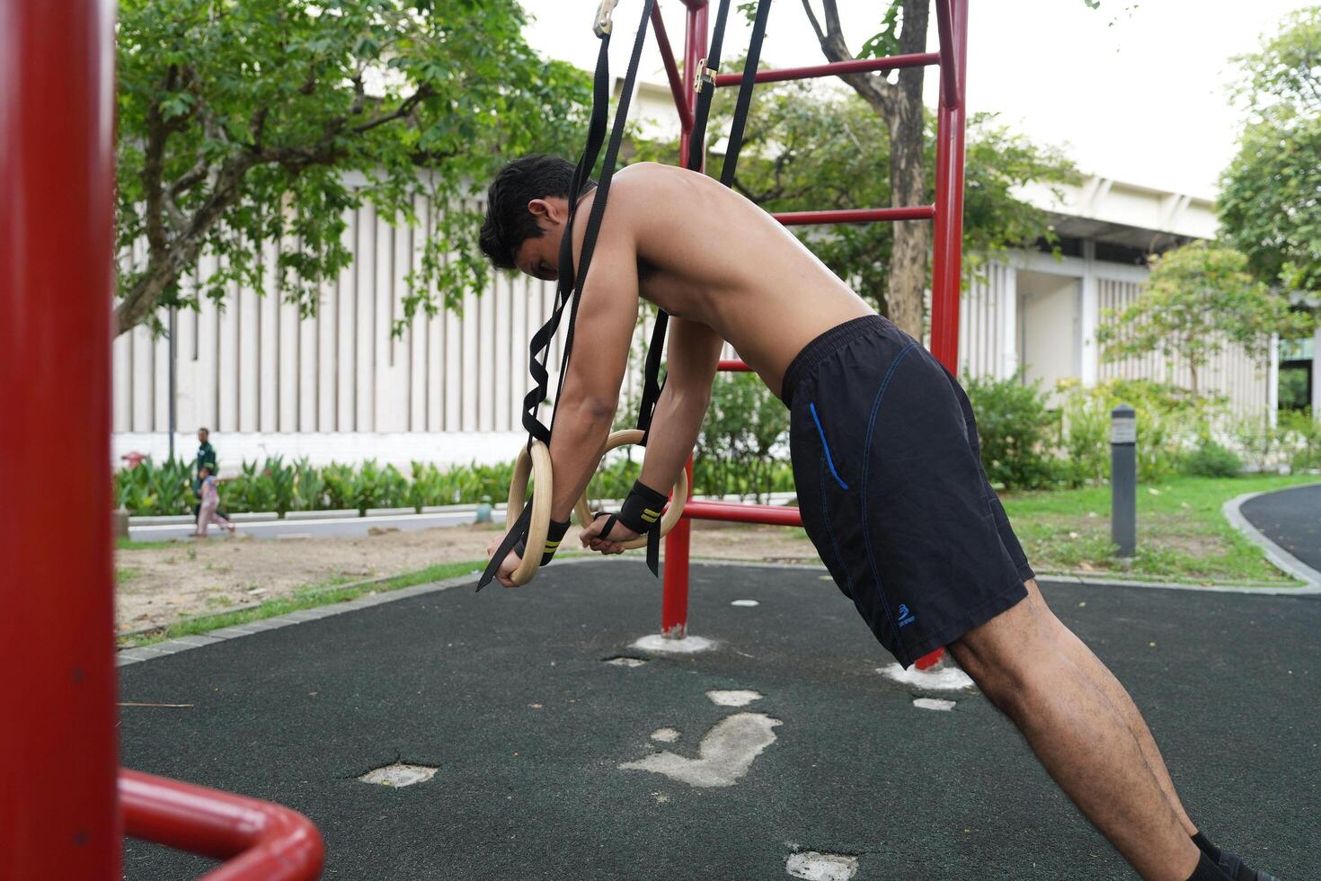 Asian men practicing swimming and polo and stretching and resting for water sports. photo