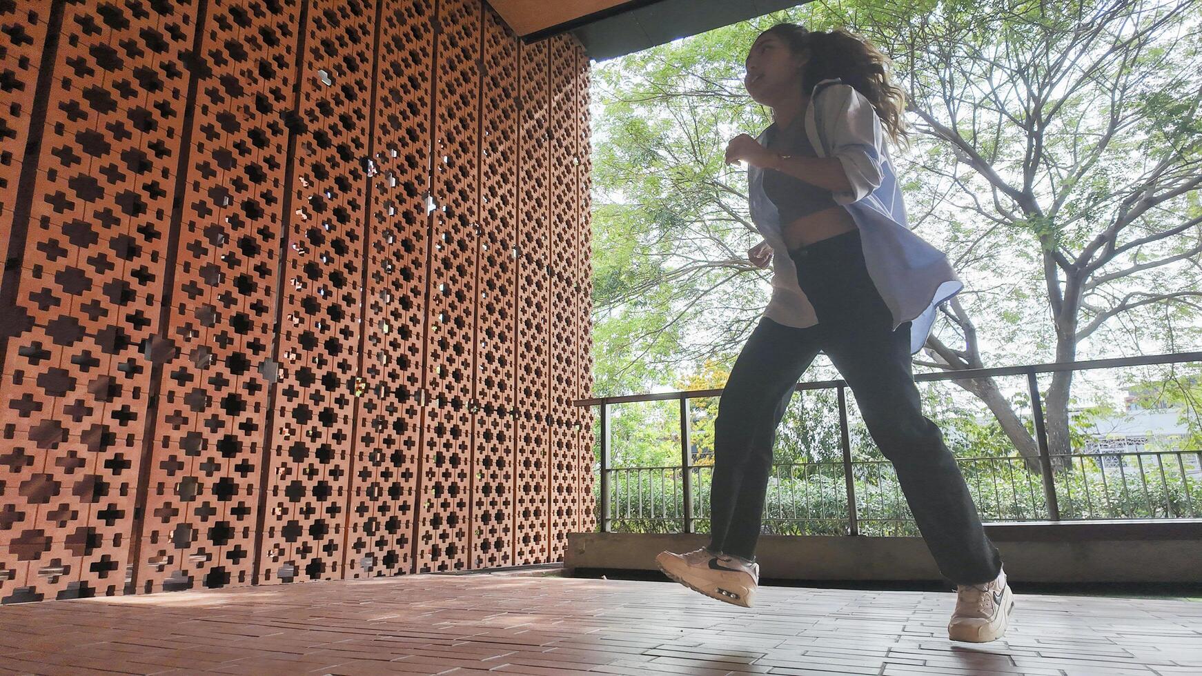 Asian girl dancing hip hop having fun With brightness and cheerfulness in the park area photo