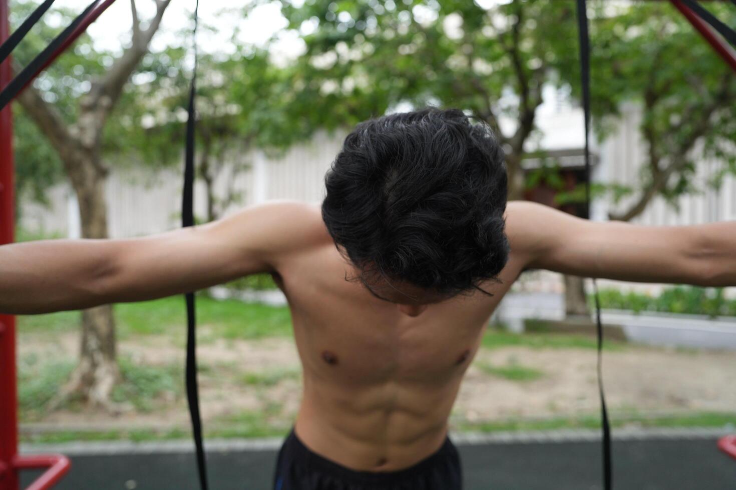 Asian men practicing swimming and polo and stretching and resting for water sports. photo
