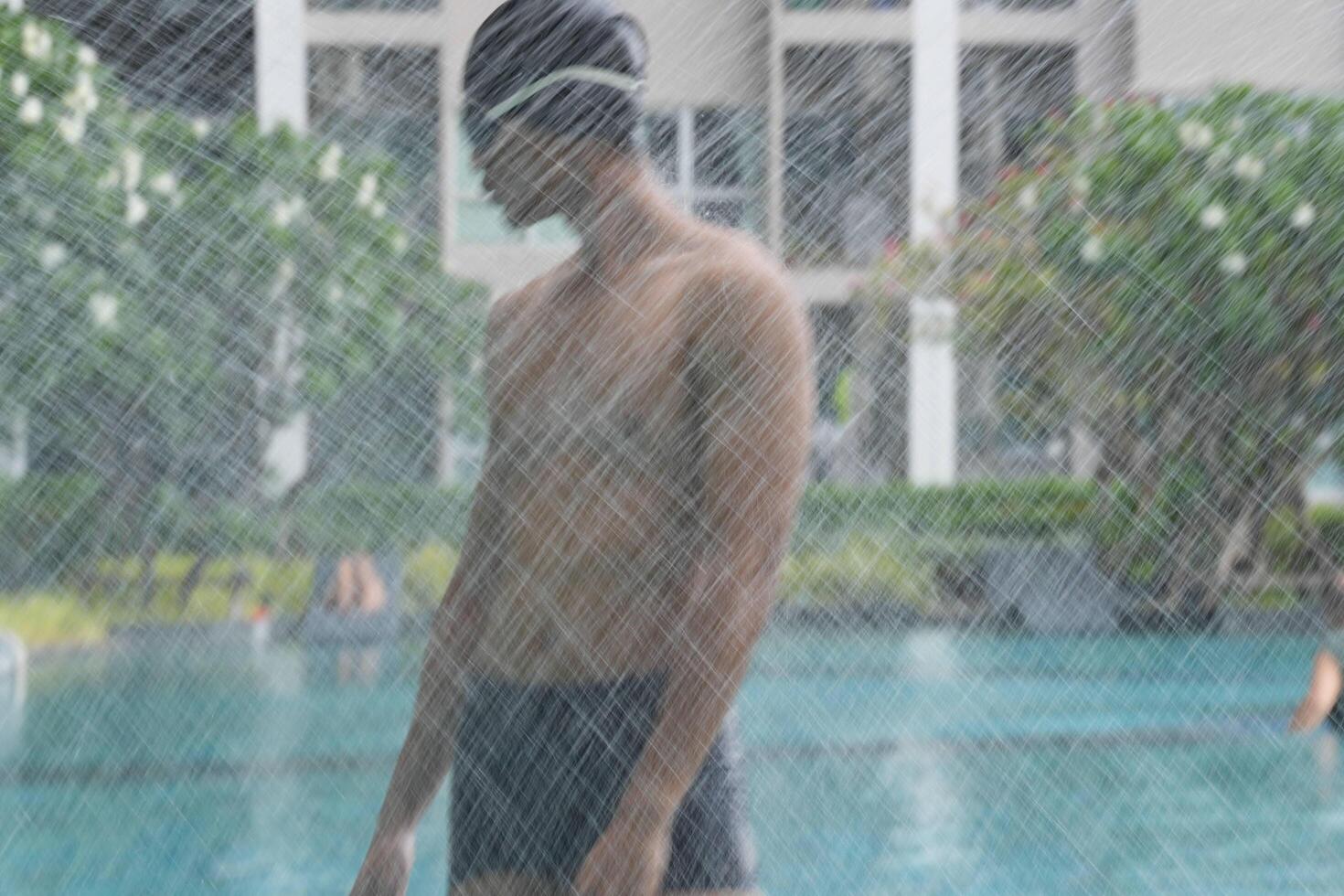 Asian men practicing swimming and preparing to play water polo and stretching and resting for water sports. photo