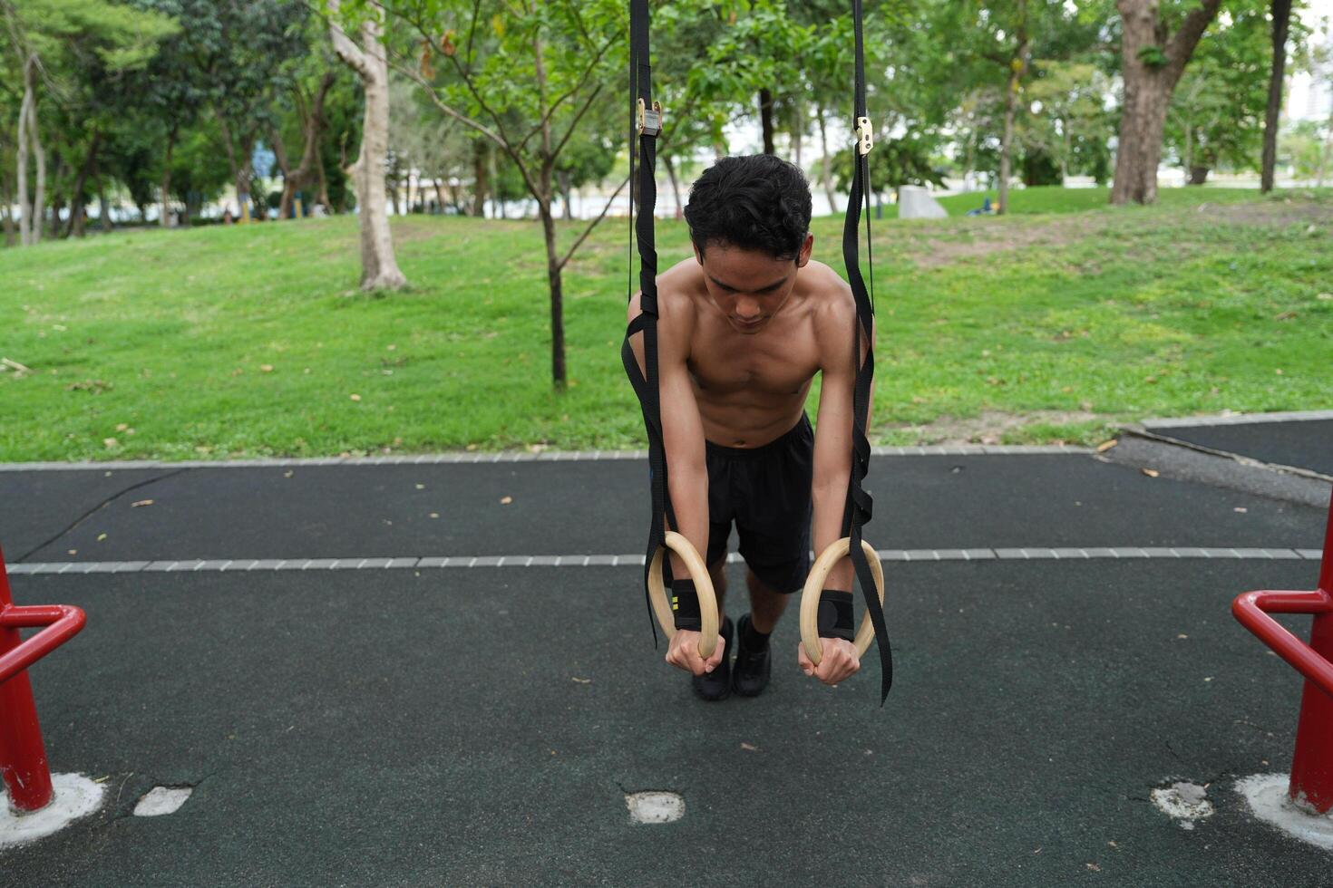 Asian men practicing swimming and polo and stretching and resting for water sports. photo