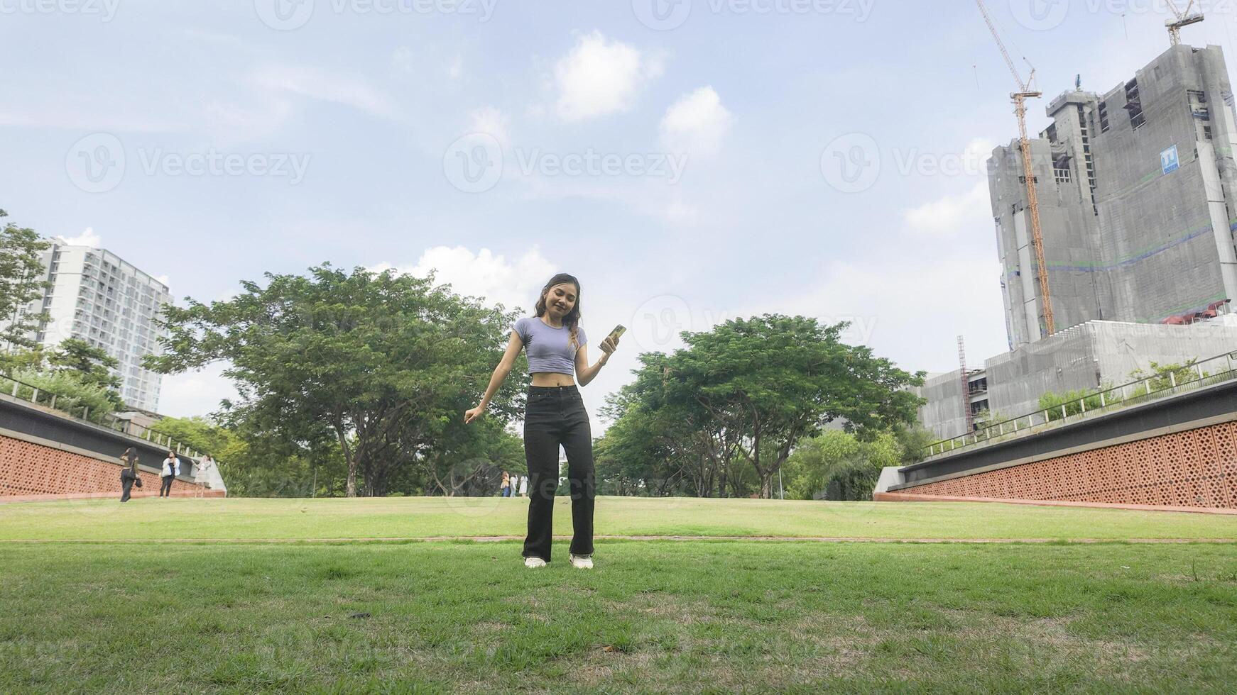 Asian women do freestyle hip hop and breakdancing in a public space in the middle of the city. With a cheerful and happy attitude photo