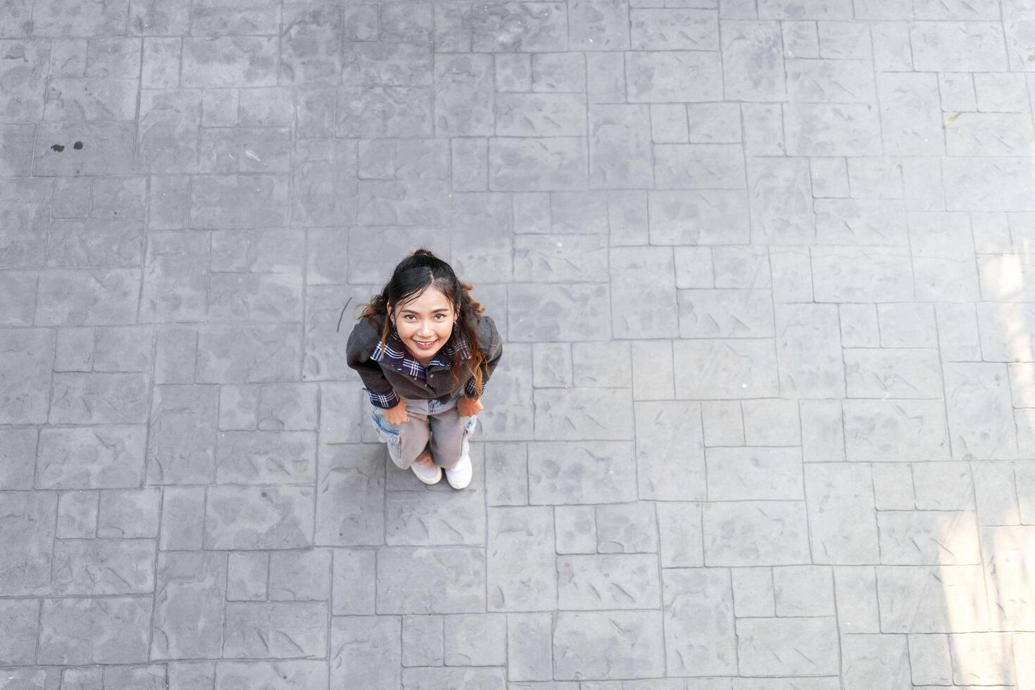 Asian women do freestyle hip hop and breakdancing in a public space in the middle of the city. With a cheerful and happy attitude photo