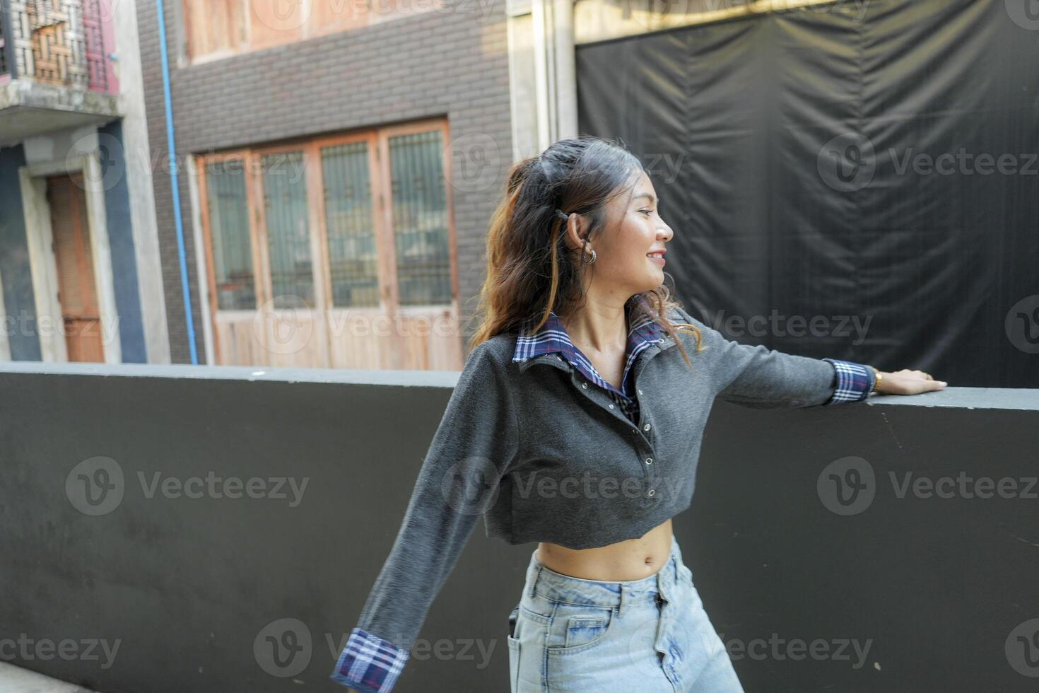 Asian women do freestyle hip hop and breakdancing in a public space in the middle of the city. With a cheerful and happy attitude photo