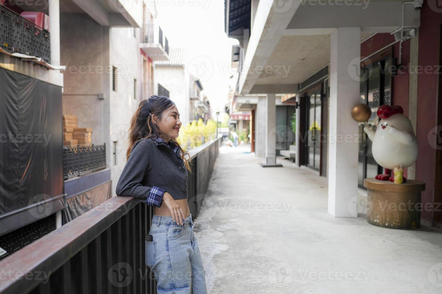 Asian women do freestyle hip hop and breakdancing in a public space in the middle of the city. With a cheerful and happy attitude photo