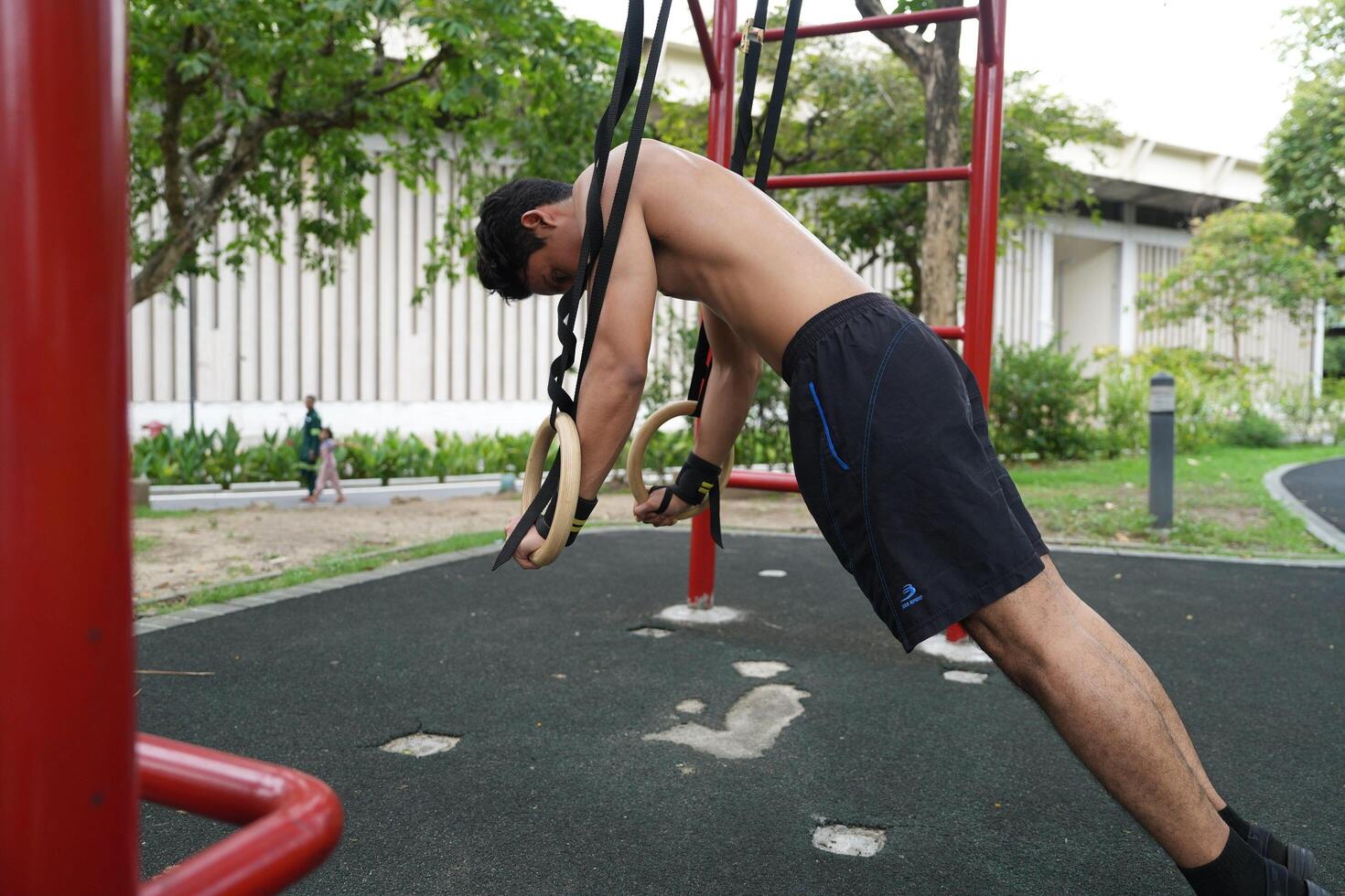 Asian men practicing swimming and polo and stretching and resting for water sports. photo