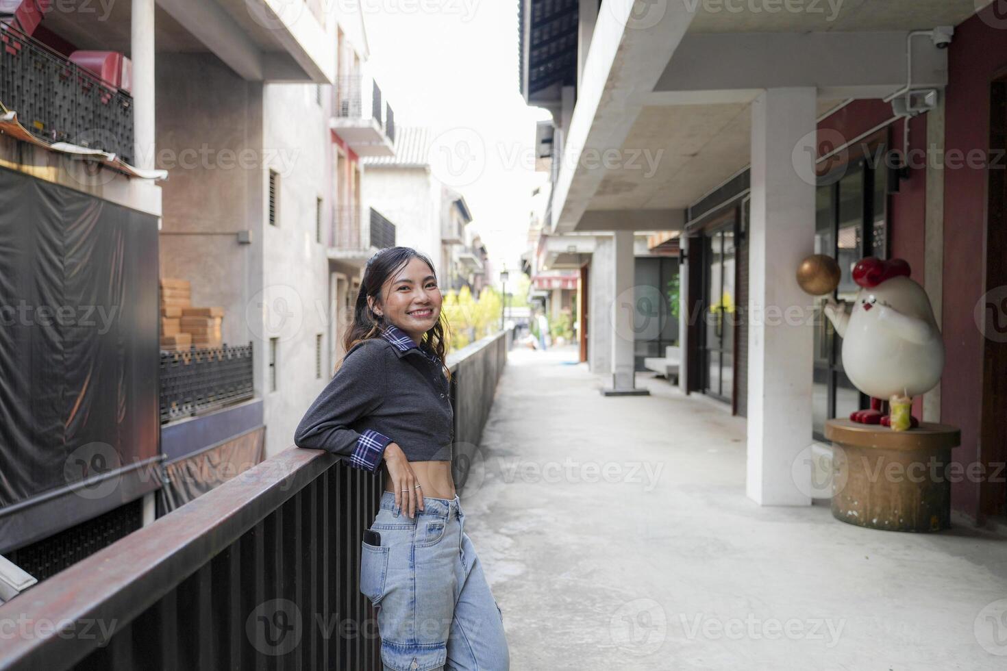 Asian women do freestyle hip hop and breakdancing in a public space in the middle of the city. With a cheerful and happy attitude photo