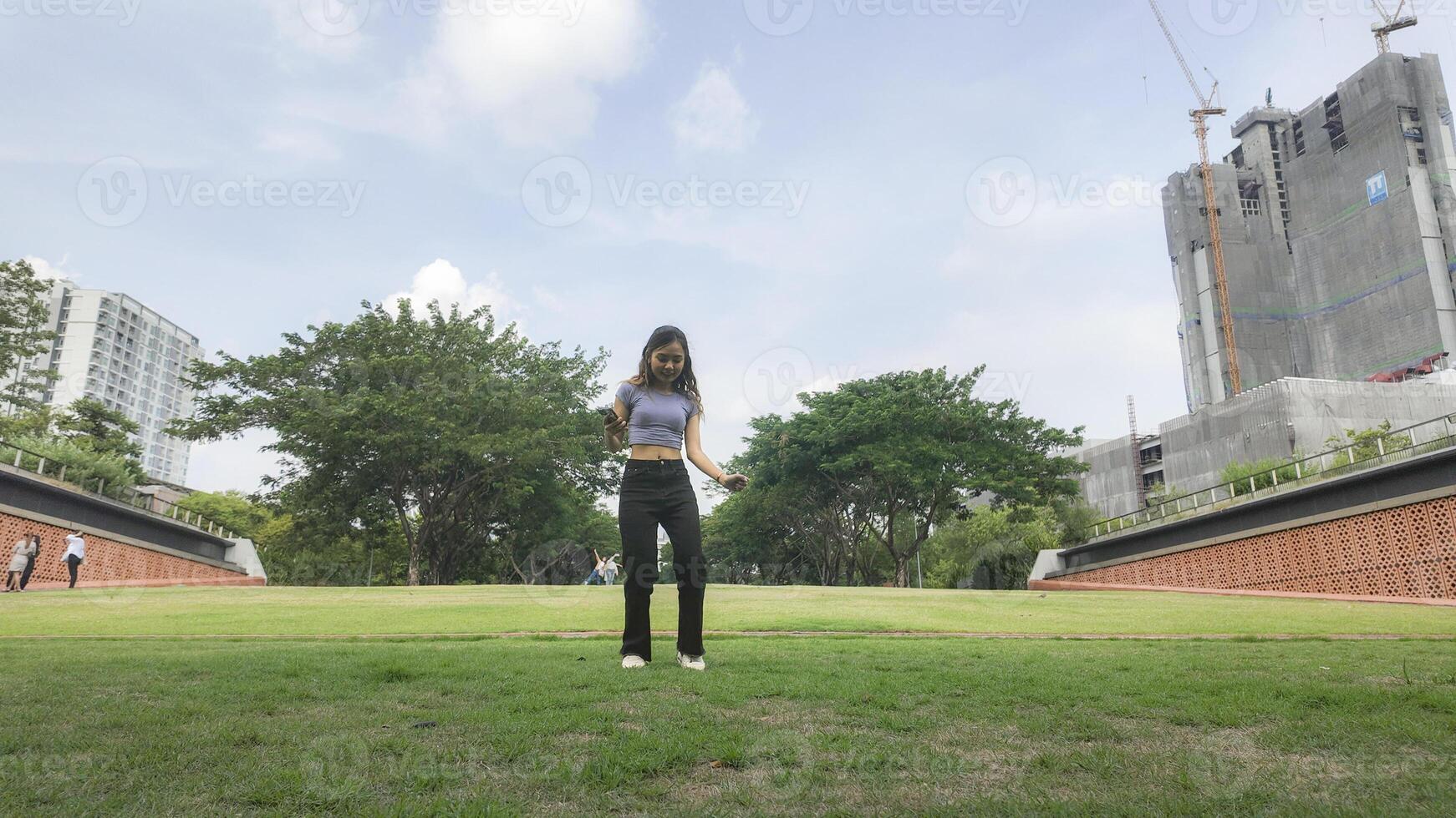 Asian women do freestyle hip hop and breakdancing in a public space in the middle of the city. With a cheerful and happy attitude photo