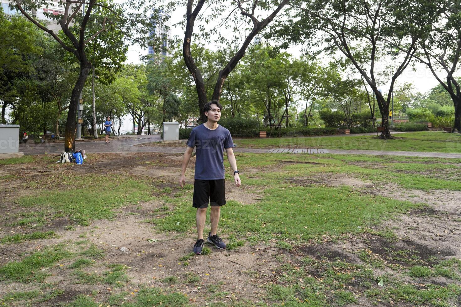 Male soccer players practice using the ball in the park field diligently and happily. photo