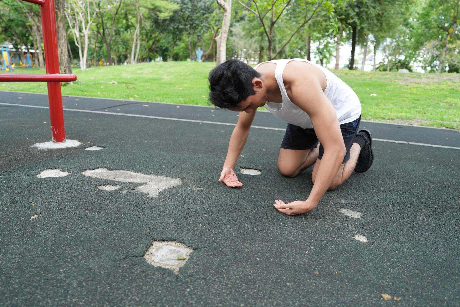Asian man practicing gymnastics doing gymnastics bar and hoop exercises and stretching and resting for sports. photo