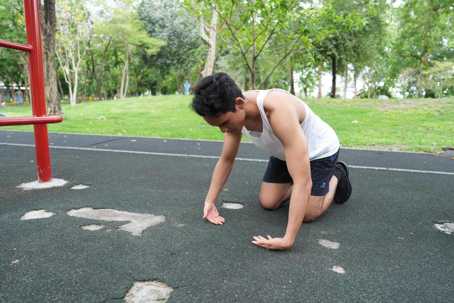 Asian man practicing gymnastics doing gymnastics bar and hoop exercises and stretching and resting for sports. photo