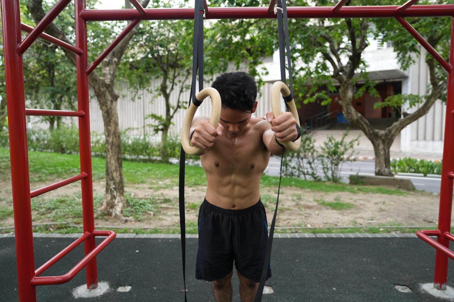 Asian men practicing swimming and polo and stretching and resting for water sports. photo