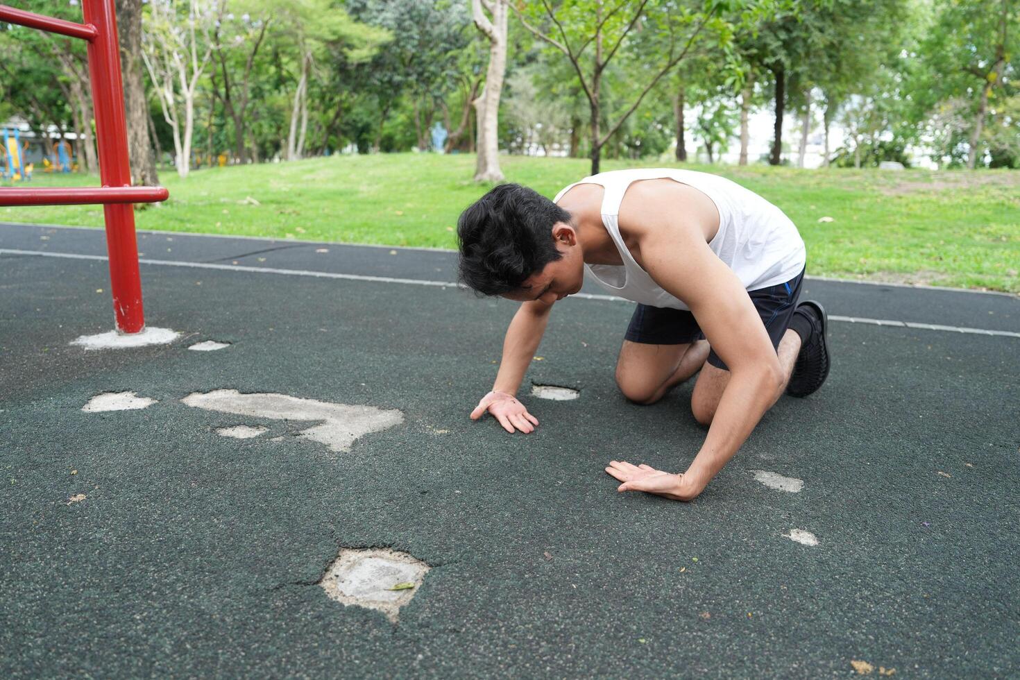 Asian man practicing gymnastics doing gymnastics bar and hoop exercises and stretching and resting for sports. photo