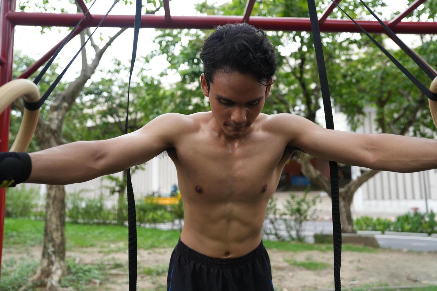 Asian men practicing swimming and polo and stretching and resting for water sports. photo