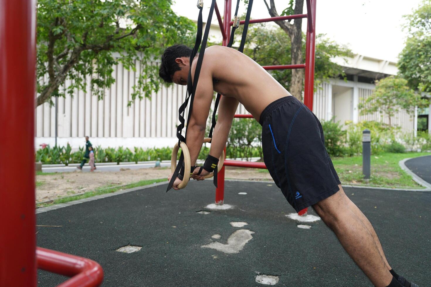 Asian men practicing swimming and polo and stretching and resting for water sports. photo