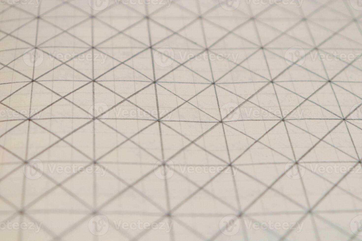 Pencil drawn grid on a notebook sheet. Flat drawn lines. photo