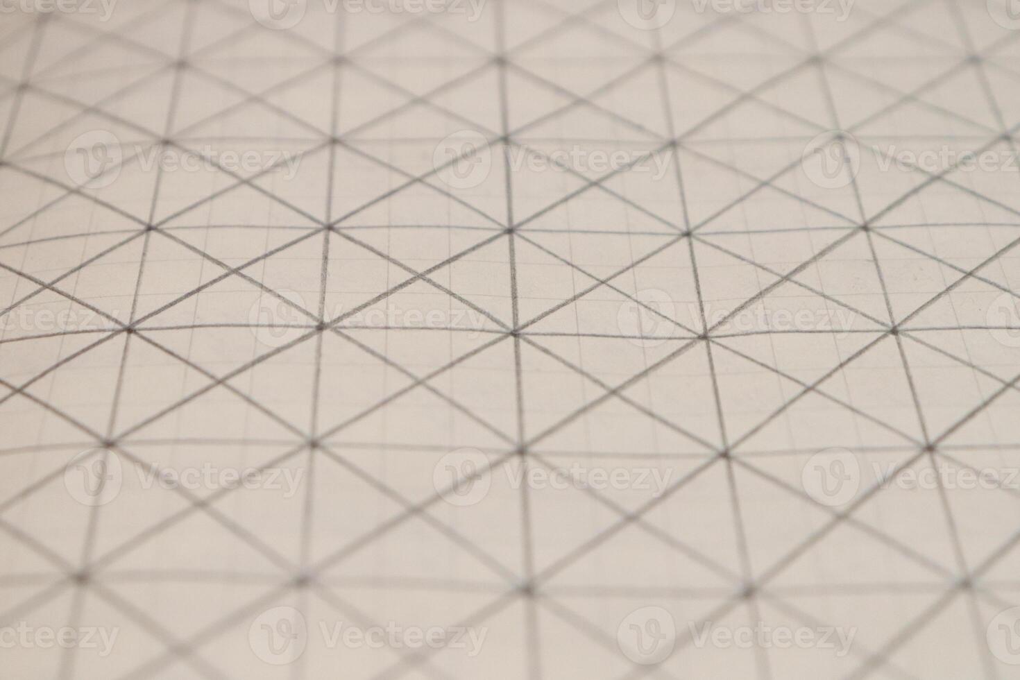 Pencil drawn grid on a notebook sheet. Flat drawn lines. photo