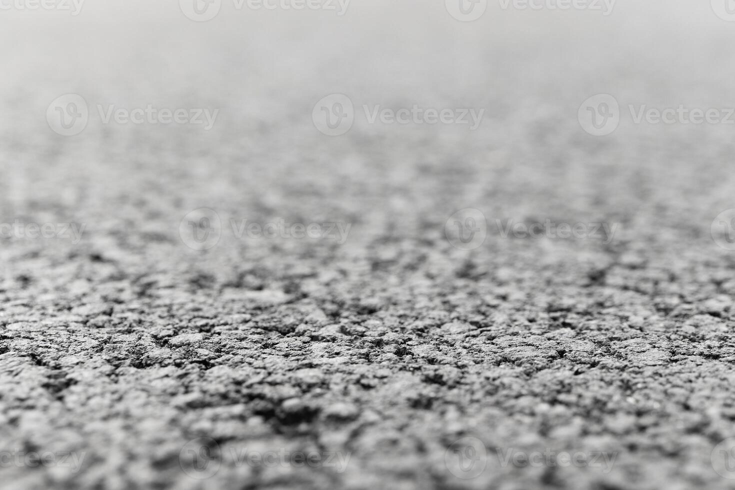 Asphalt Road focused foreground with blurred background. photo