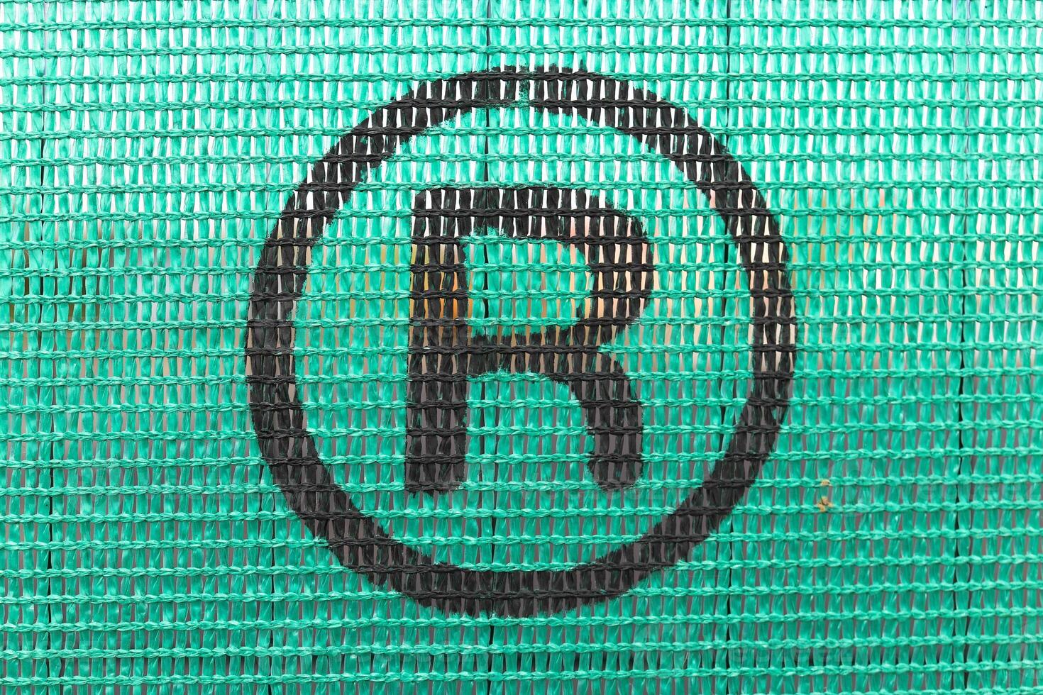 Tennis advertising net with painted R emblem photo