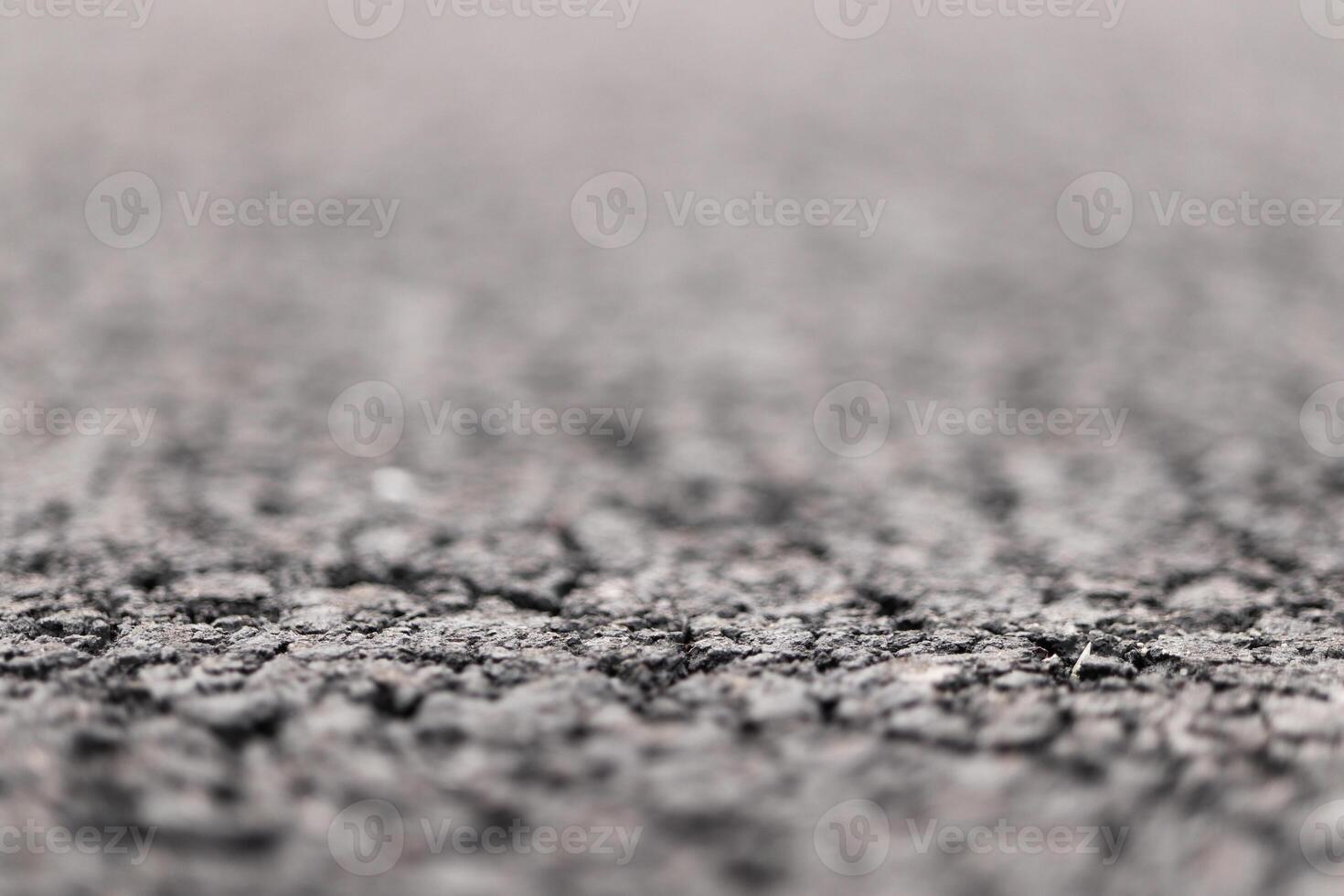 Asphalt Road focused foreground with blurred background. photo