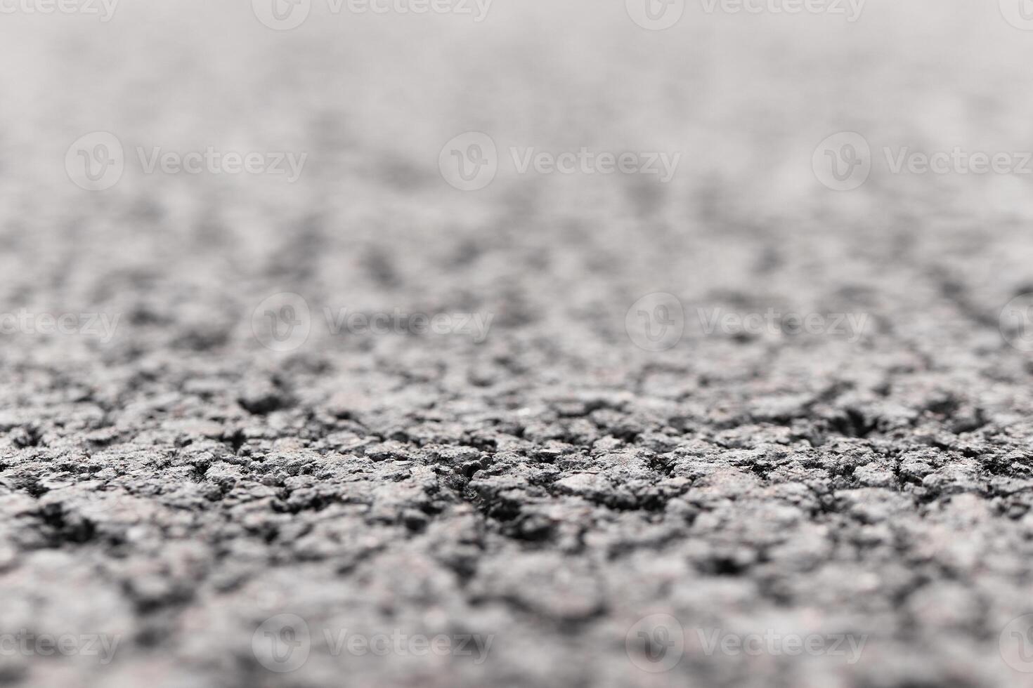 Asphalt Road focused foreground with blurred background. photo