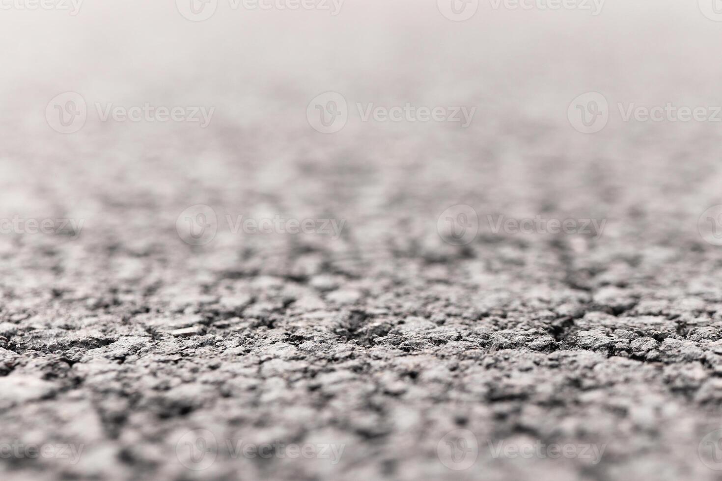 Asphalt Road focused foreground with blurred background. photo