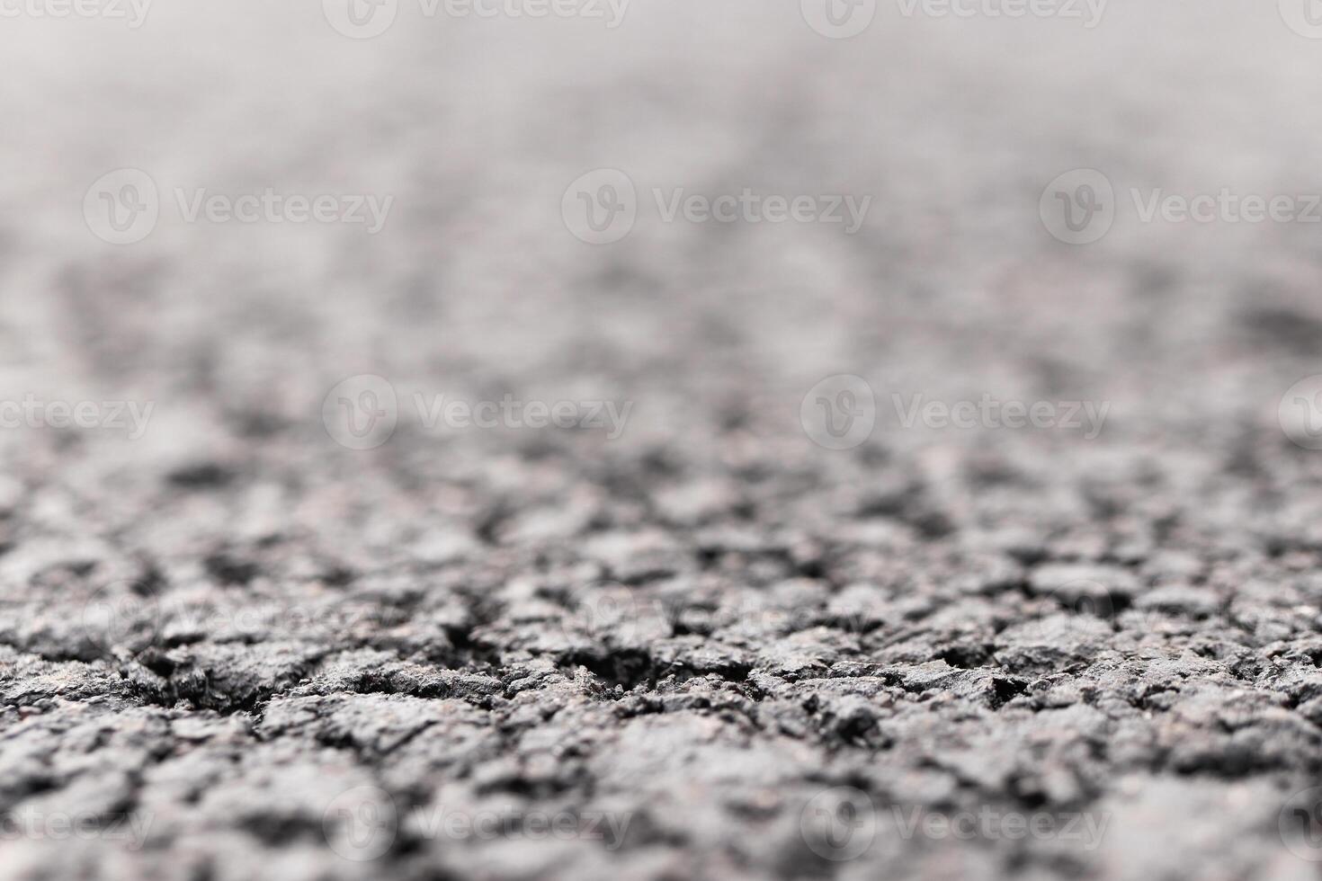 Asphalt Road focused foreground with blurred background. photo